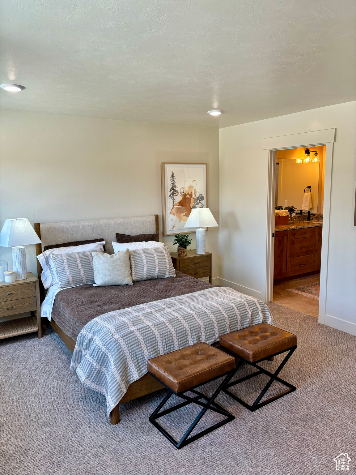 Carpeted bedroom with ensuite bath