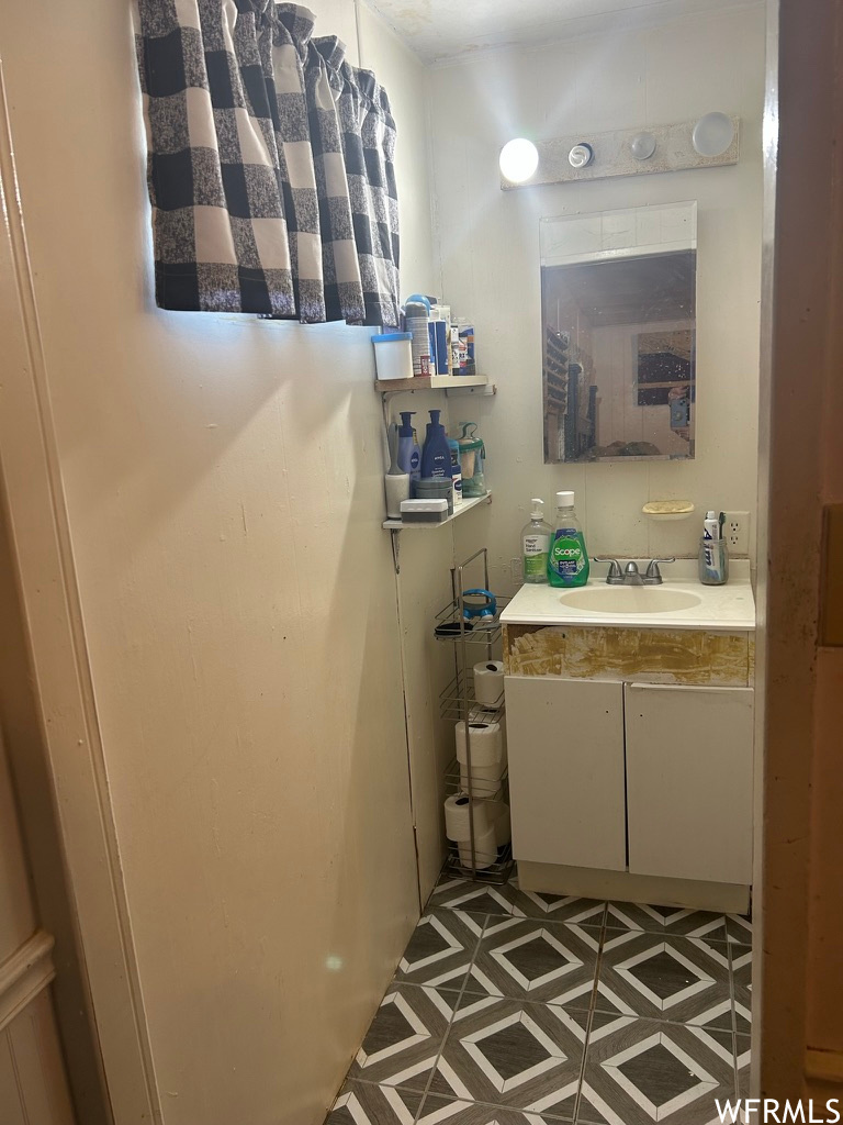 Master Bathroom featuring tile floors, mirror, and vanity