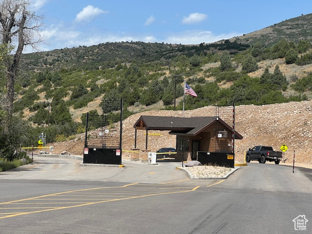 Exterior space with a mountain view and a carport