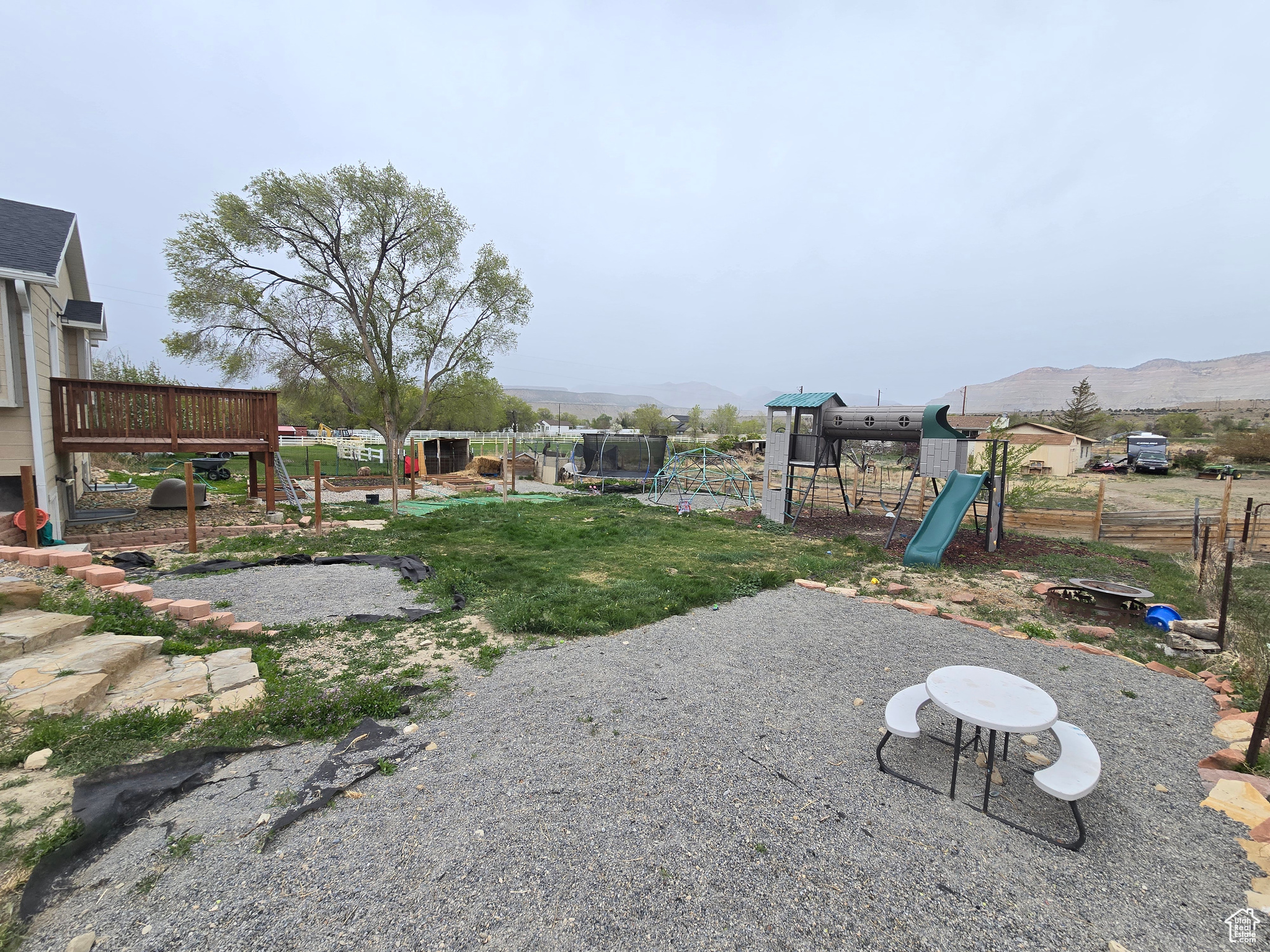 View of yard featuring a playground and a mountain view