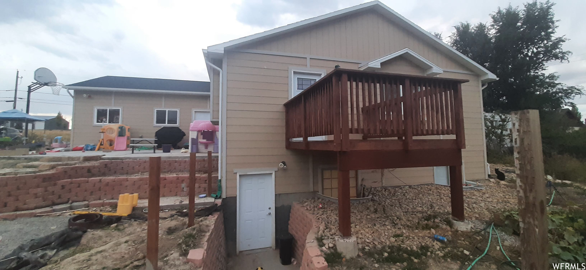 Rear view of property with a wooden deck