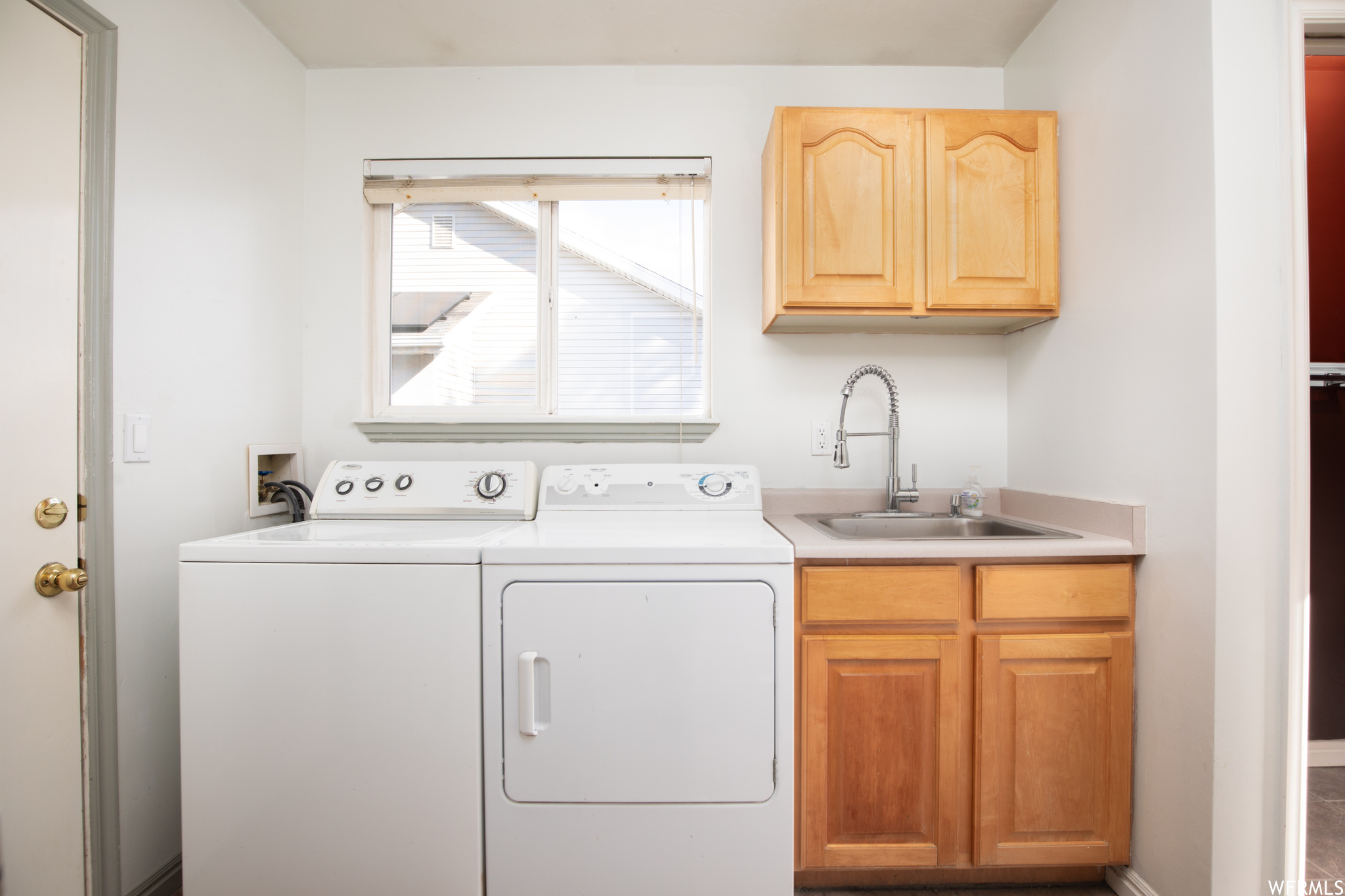 Laundry room featuring washer and dryer.