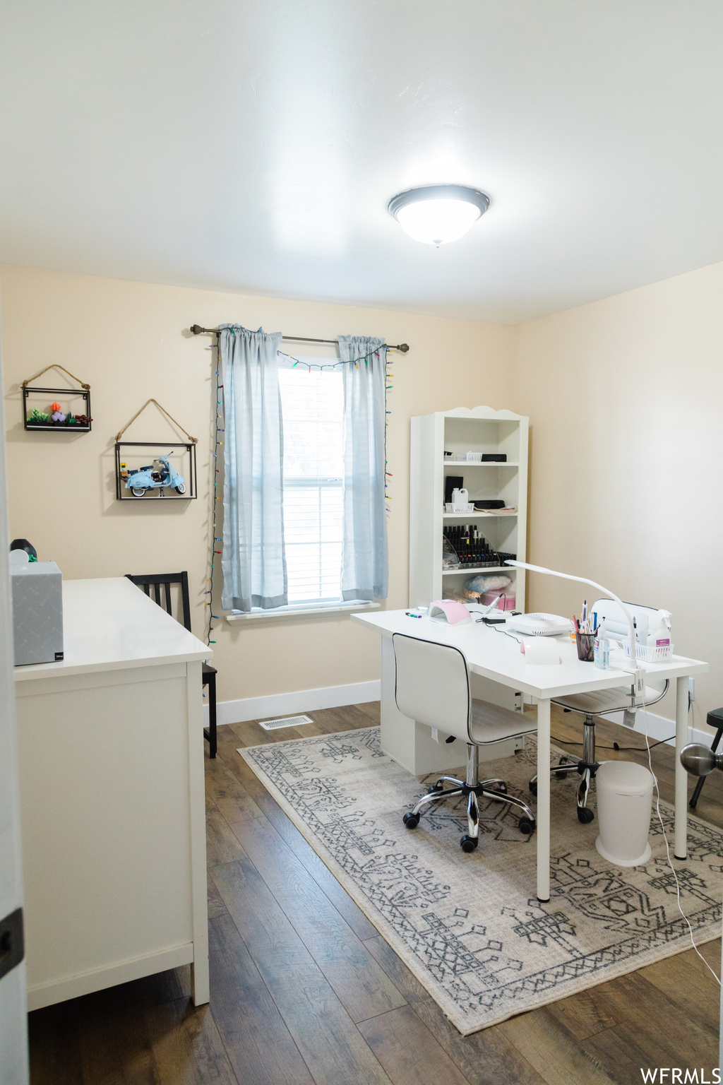 Office space featuring hardwood flooring