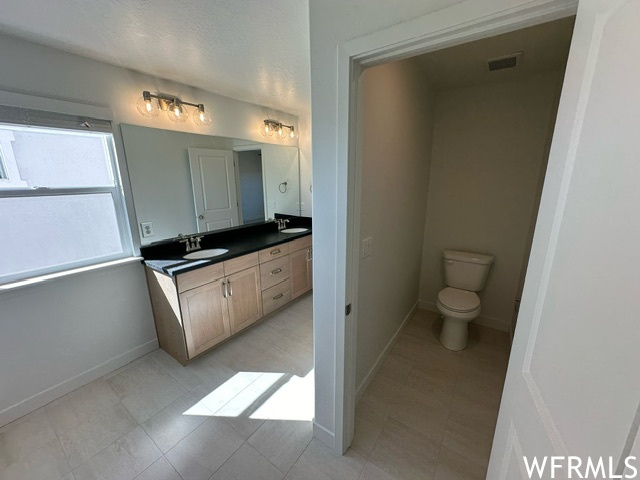 Master bath and private toilet room.