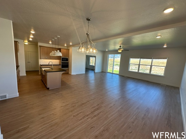 Great room on entry with laminate flooring.
