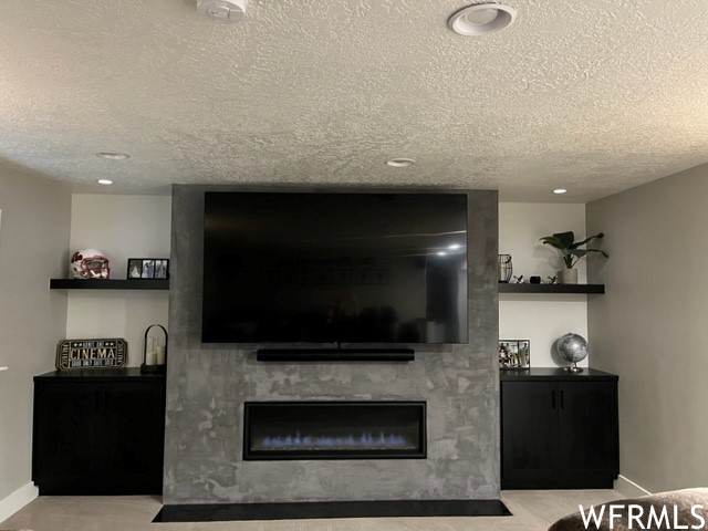 Custom cabinets and concrete wrapped fireplace.