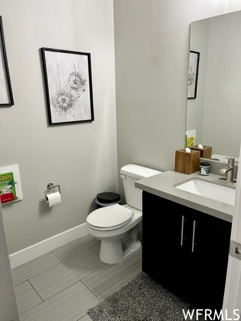 Half bath at garage entry, next to mudroom to keep messes confined.