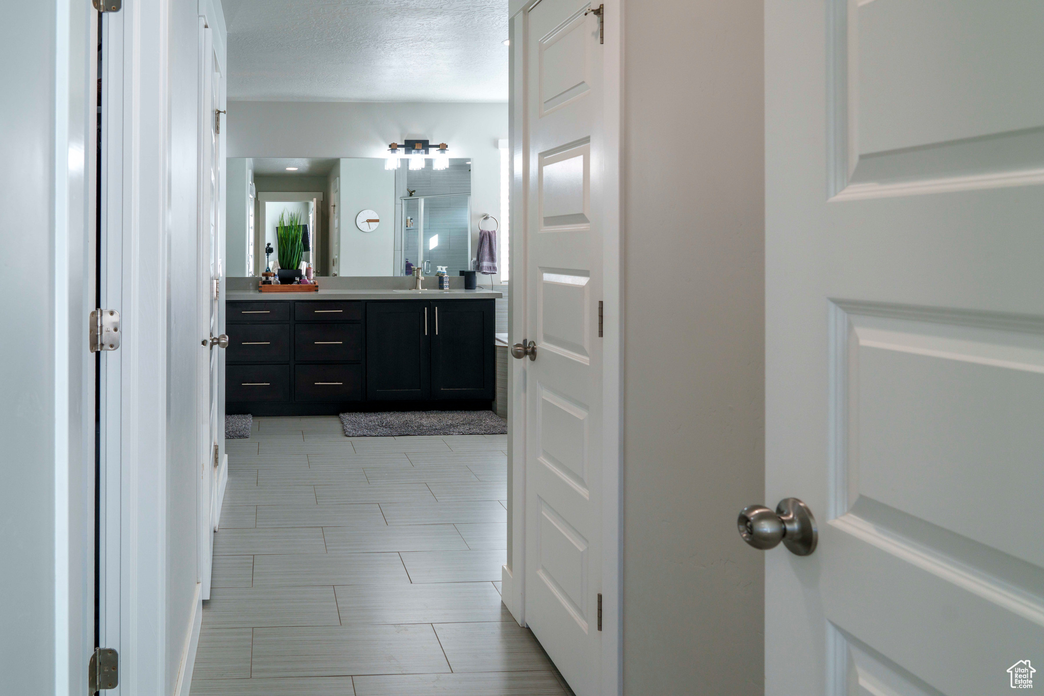Hallway access from master bedroom to walk-in closet, master bathroom and linen closet.