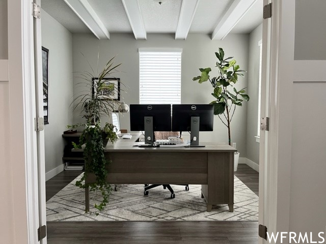 Office featuring beam ceiling