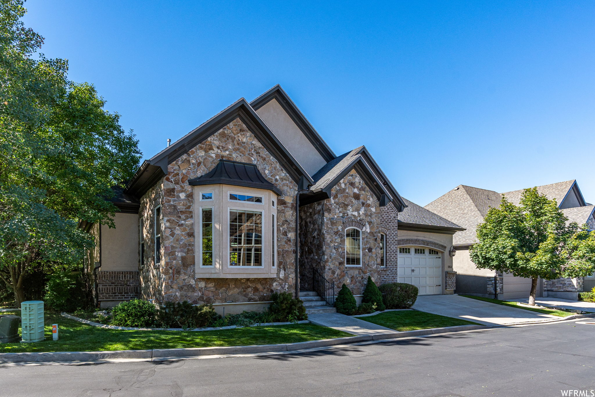 View of front of property featuring a garage