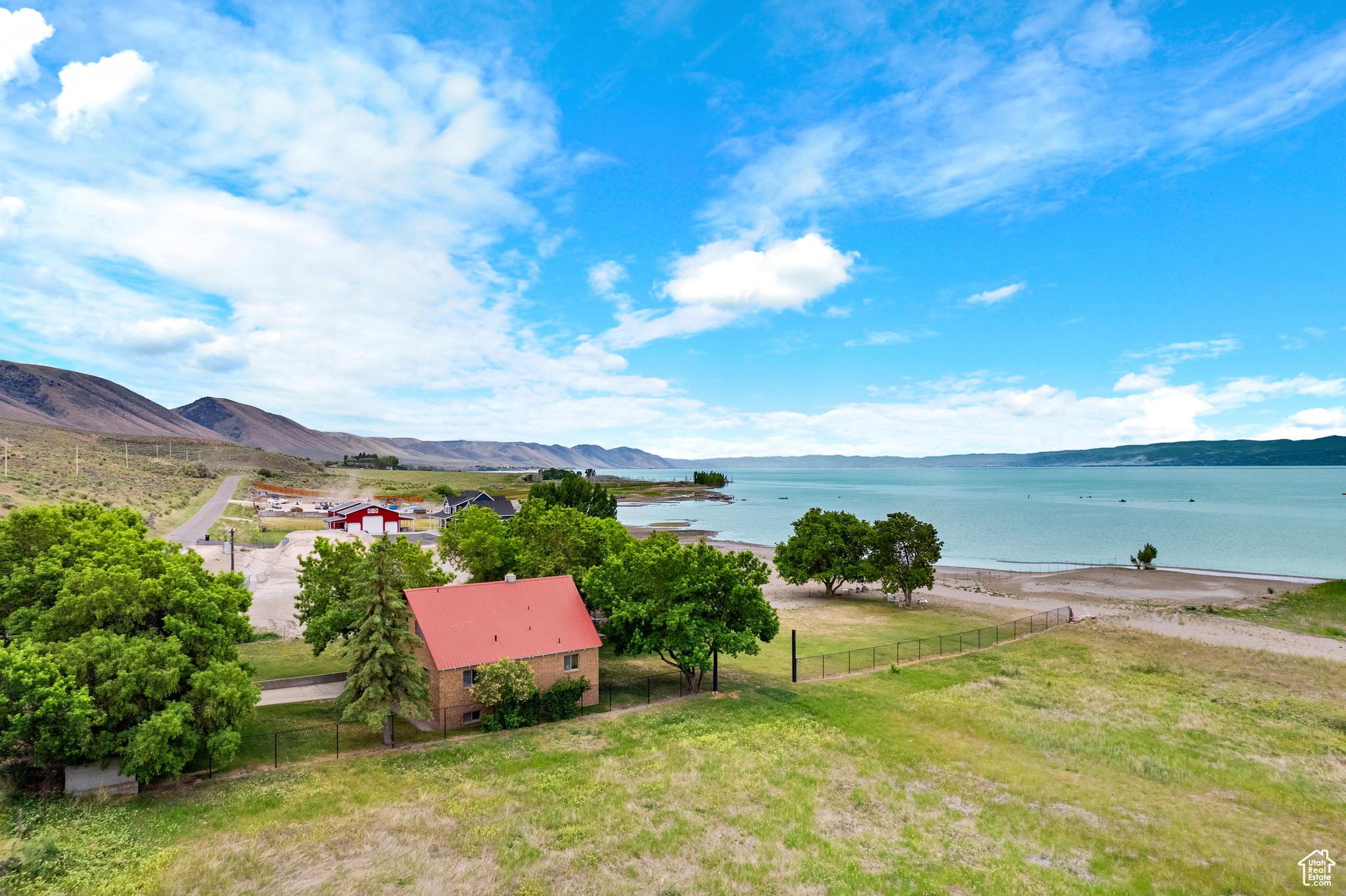 Exterior space with a water and mountain view