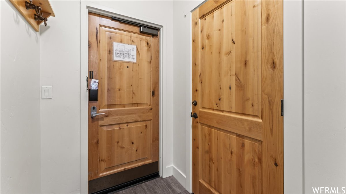 Entryway featuring dark hardwood floors