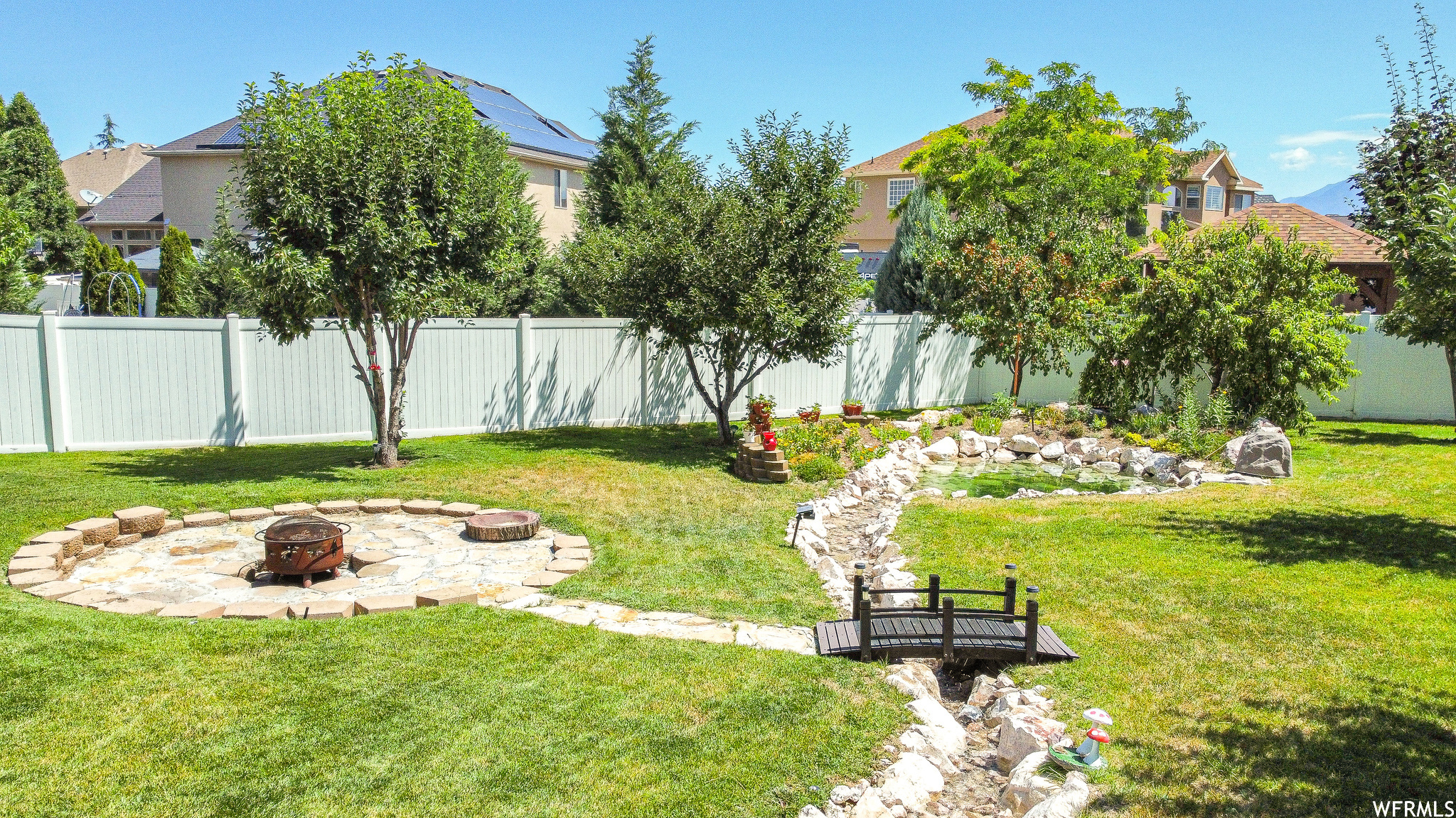 View of yard featuring an outdoor fire pit