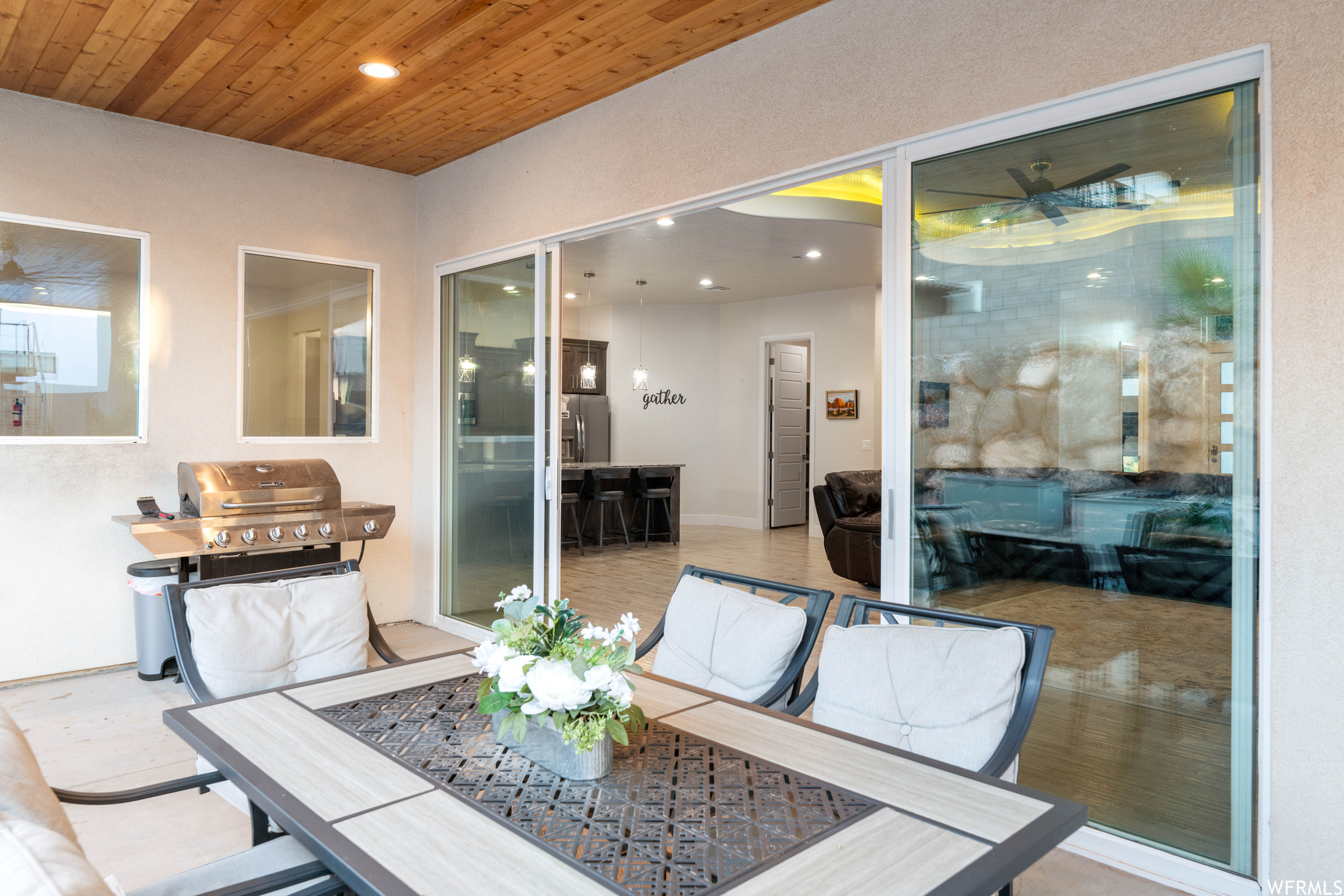 Dining room with wooden ceiling and light hardwood / wood-style flooring