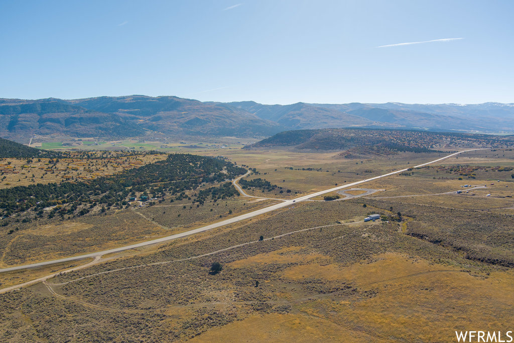 Birds eye view of property featuring a rural view and a mountain view