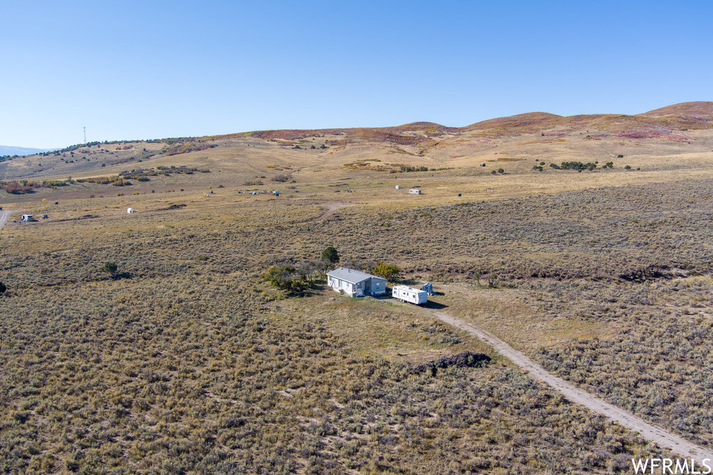 Birds eye view of property featuring a rural view and a mountain view