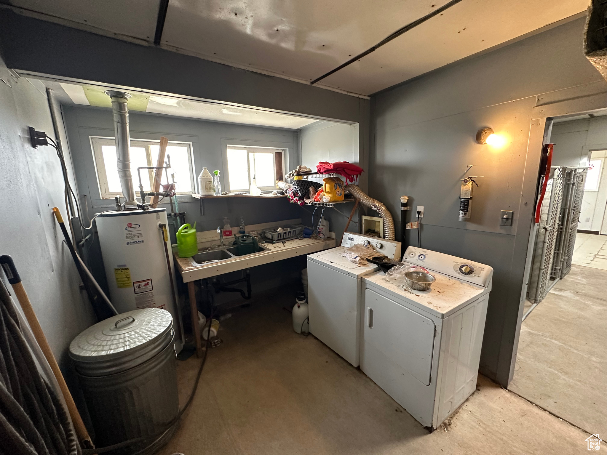 Laundry room with washer and dryer, washer hookup, and gas water heater