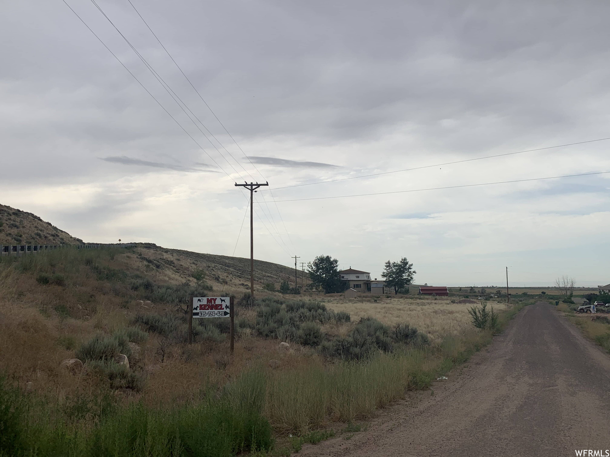 View from the street of the property featuring a mountain view