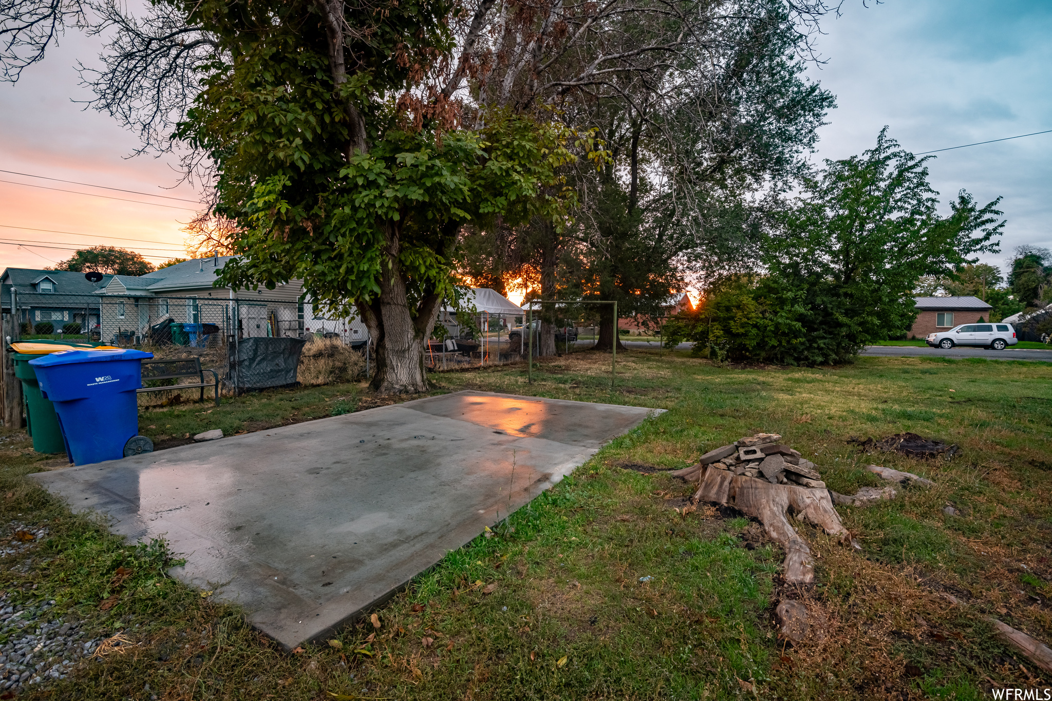 View of the south back end of the lot, including the cement pad for a shed