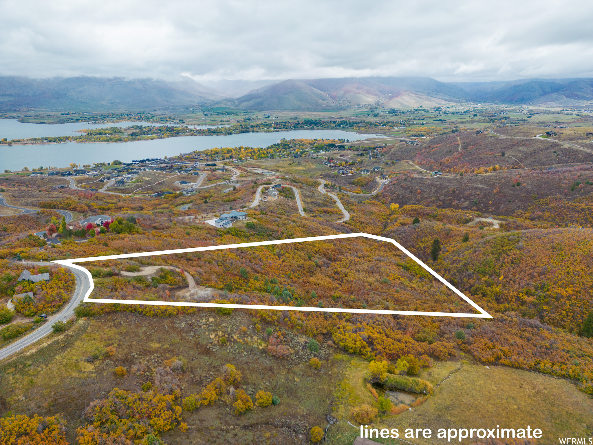 Aerial view featuring a water and mountain view