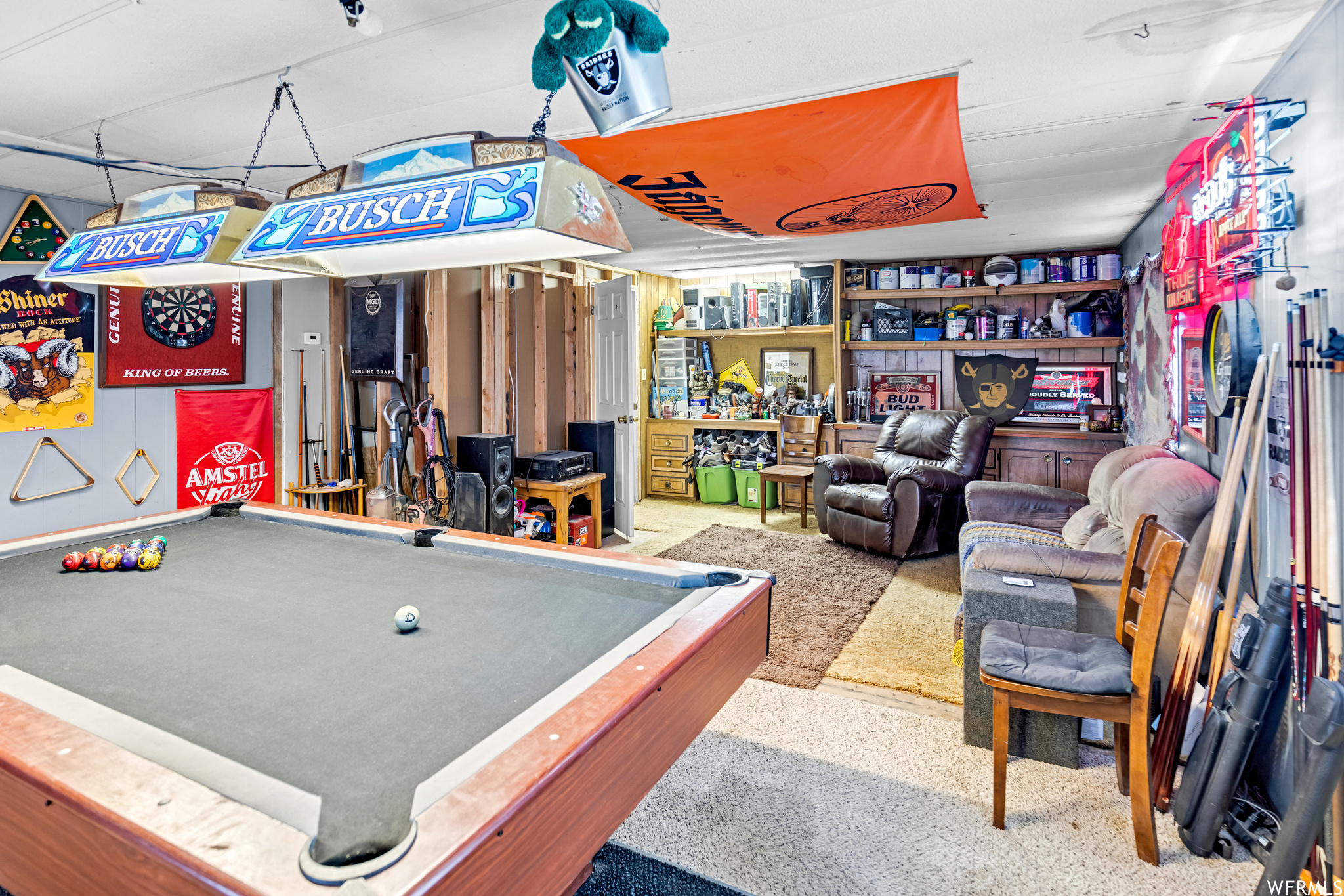 Game room with indoor bar and pool table