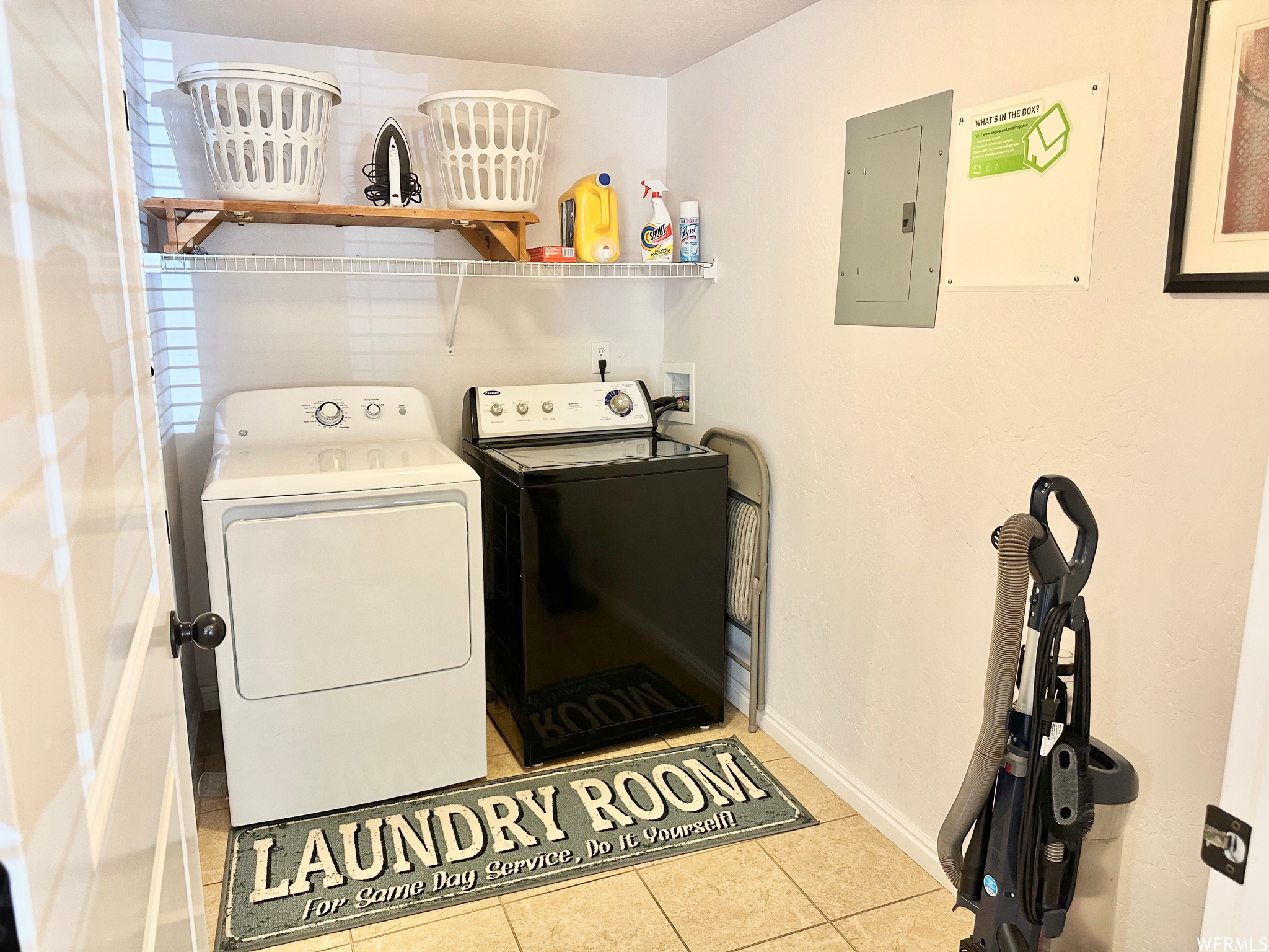Washroom featuring washing machine and clothes dryer, hookup for a washing machine, and light tile floors