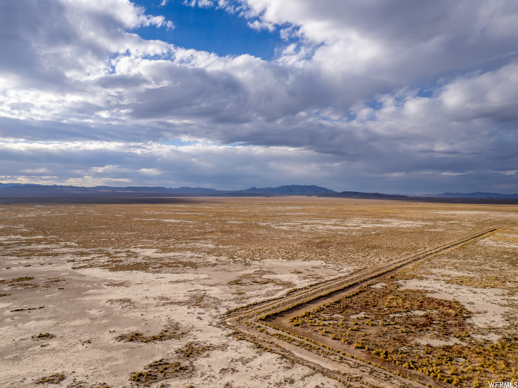 Birds eye view of property with a rural view