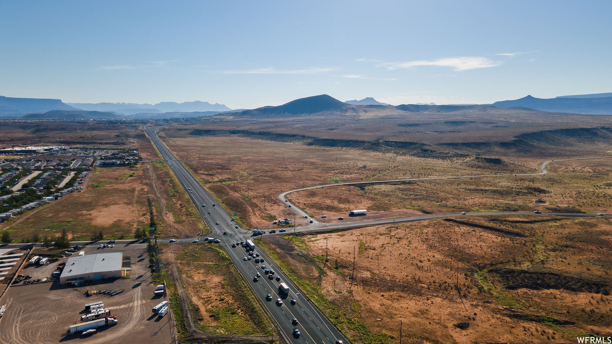 Birds eye view of property with a mountain view