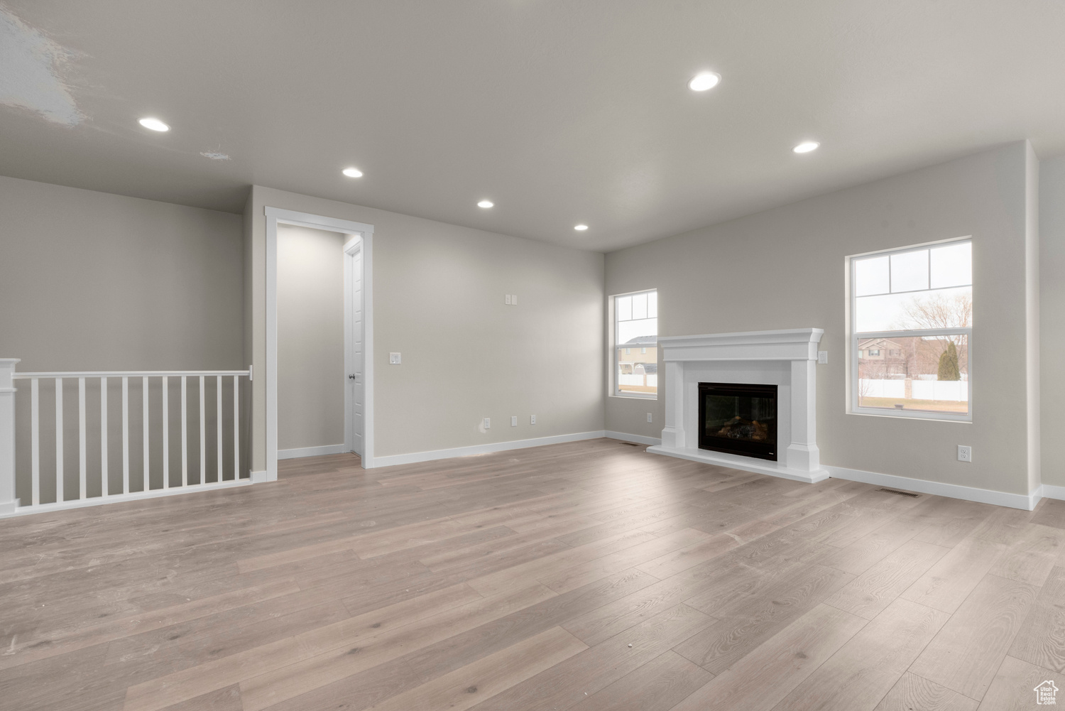 Unfurnished living room featuring light hardwood / wood-style floors