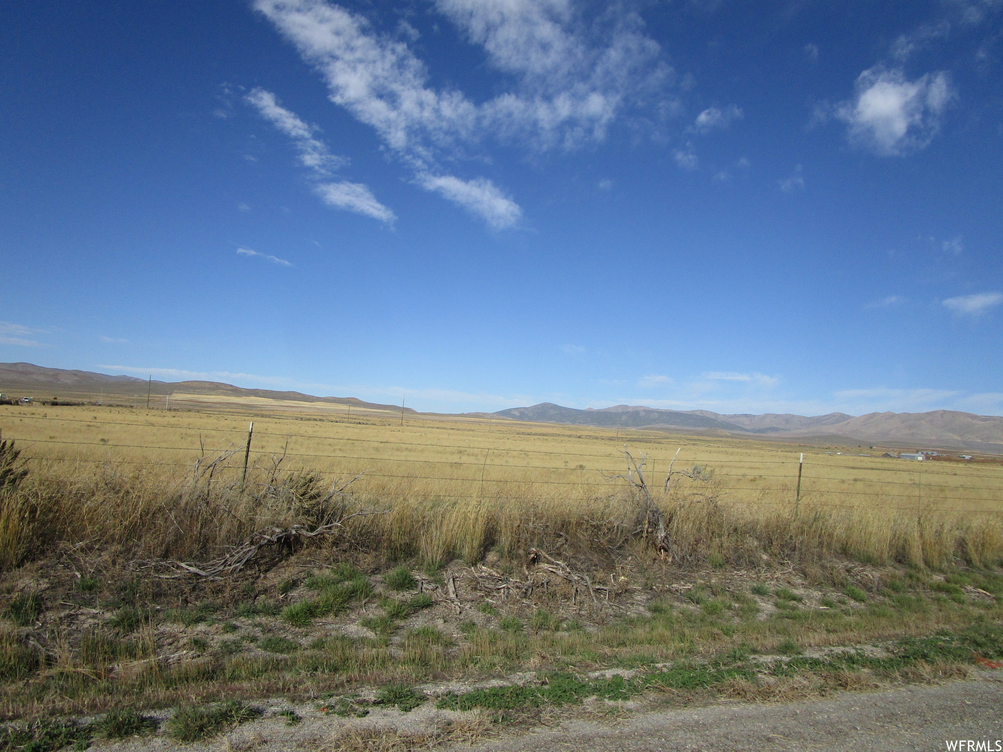 View of mother earth's splendor featuring a rural view and a mountain view