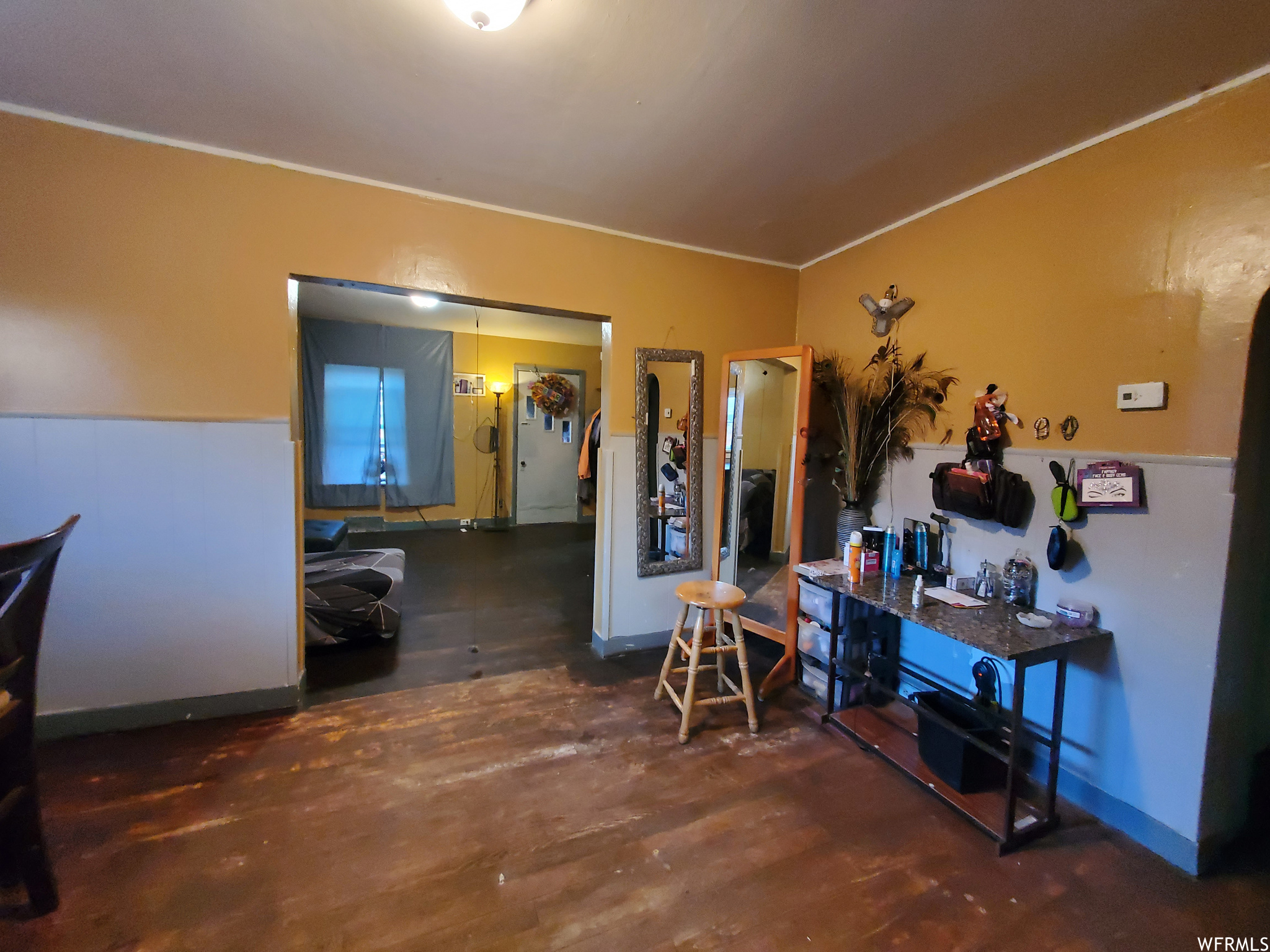 Miscellaneous room with ornamental molding and dark hardwood / wood-style floors