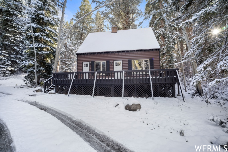 View of front facade featuring a wooden deck