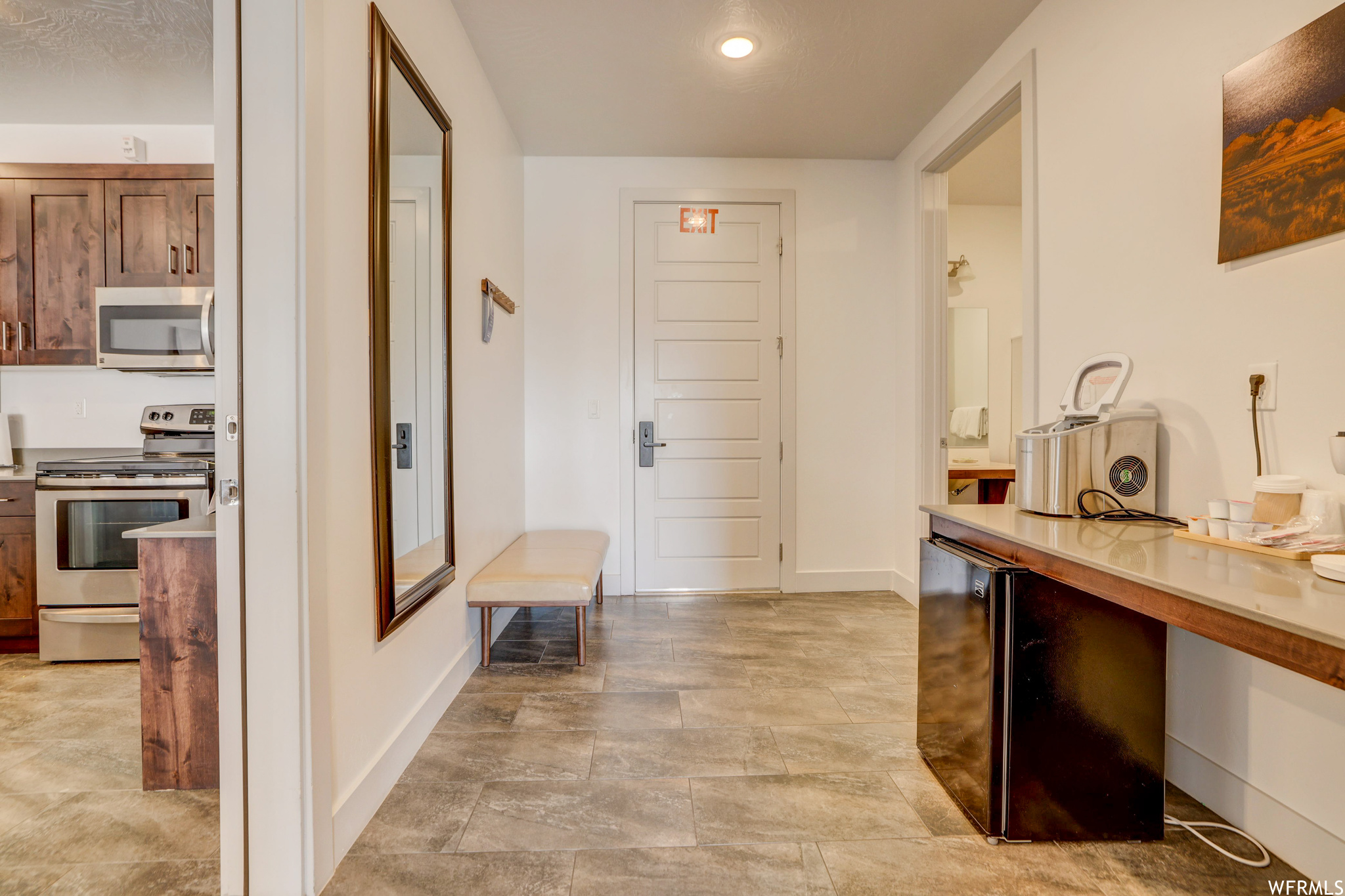 Corridor with light tile floors