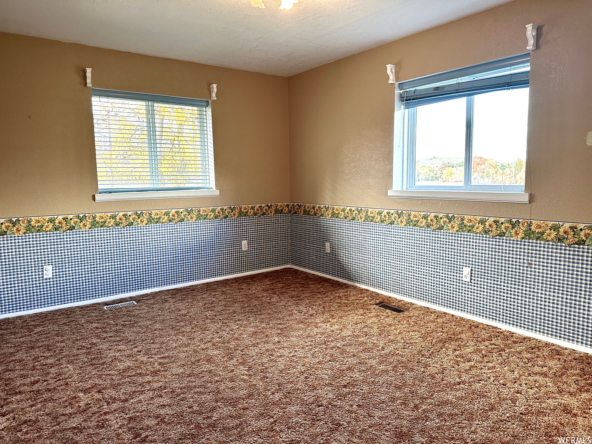 View of  bedroom featuring large windows