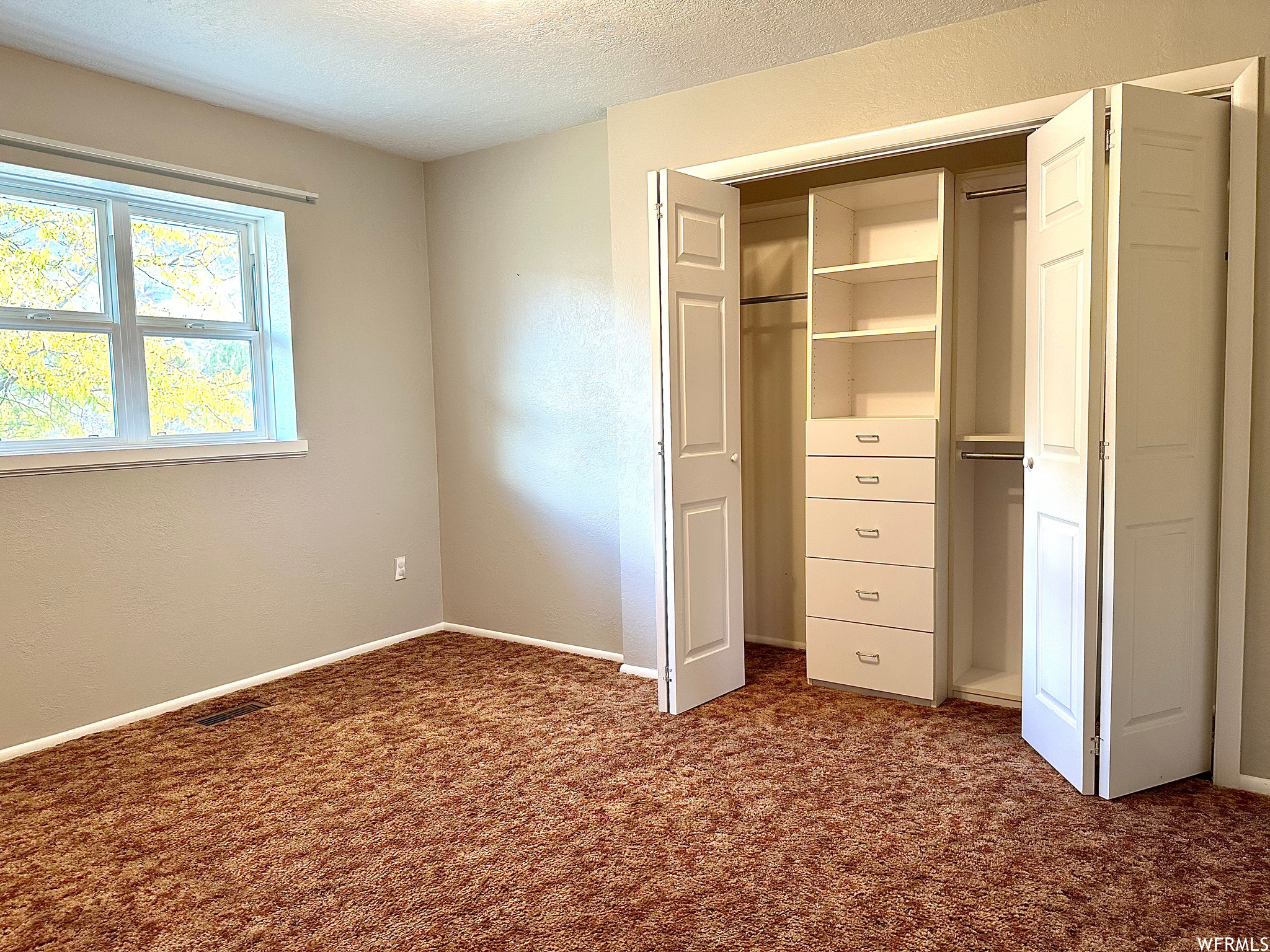 View of closet in bedroom