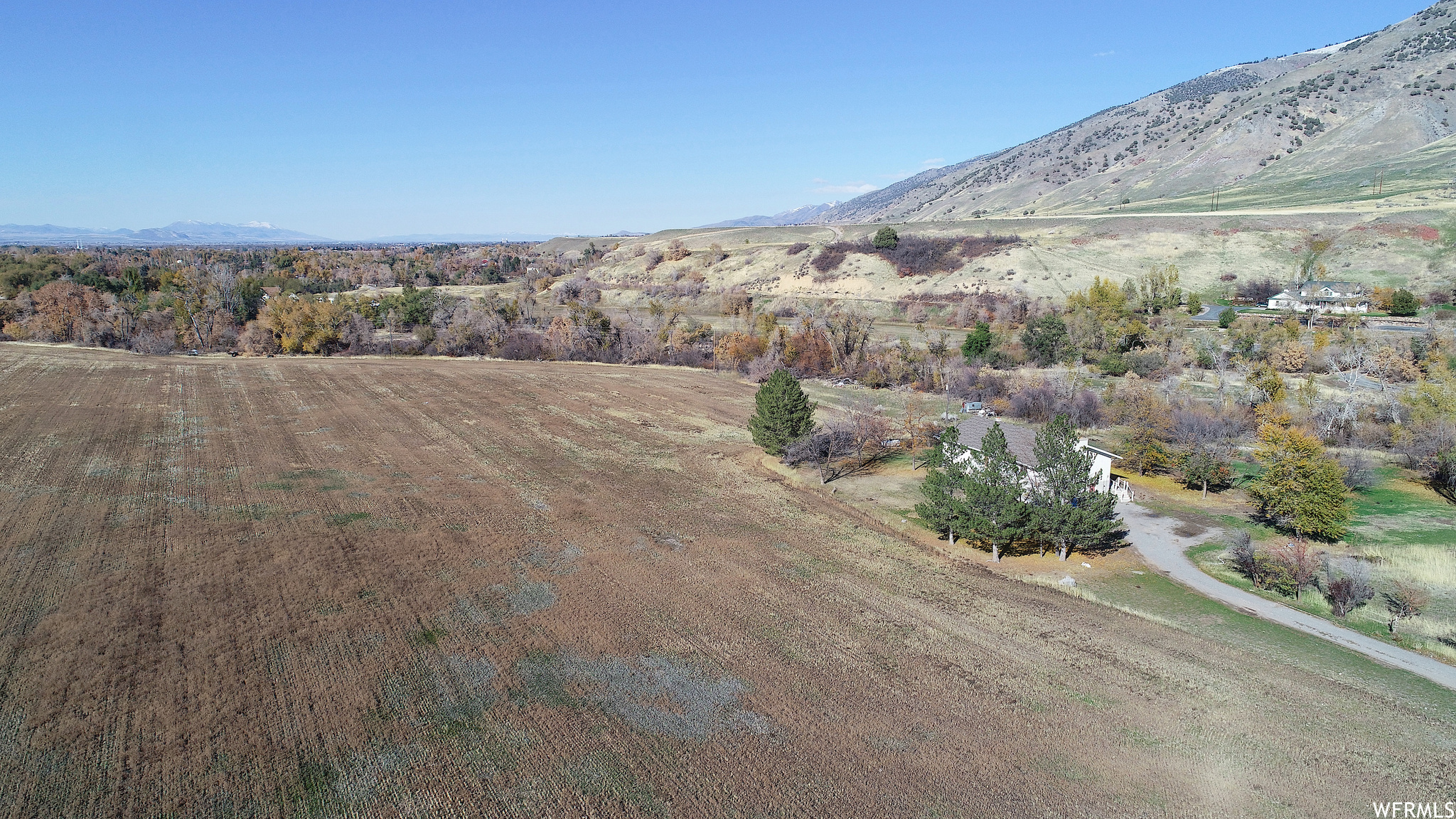 View of property and home in trees looking north