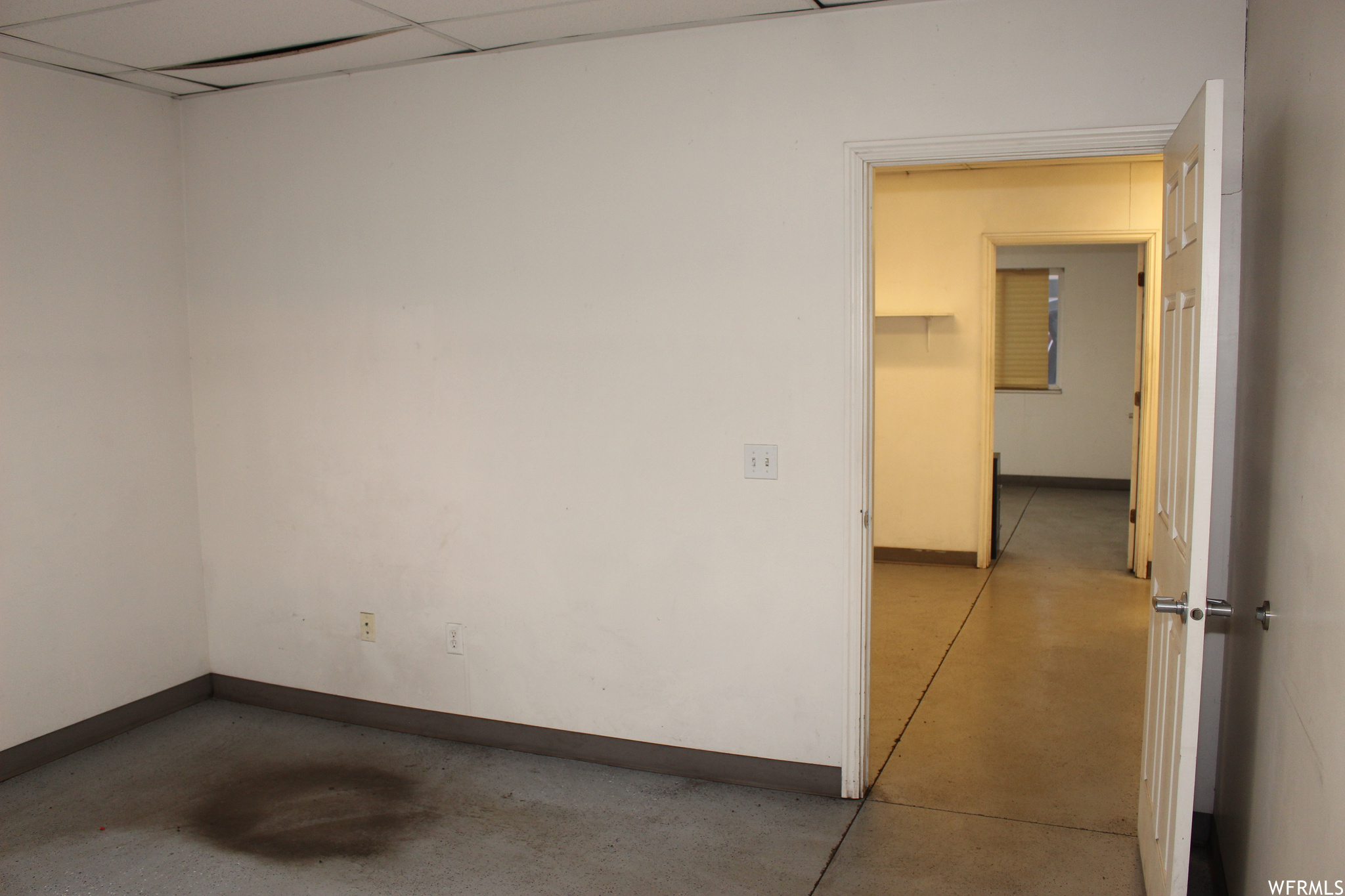 Unfurnished room featuring a paneled ceiling