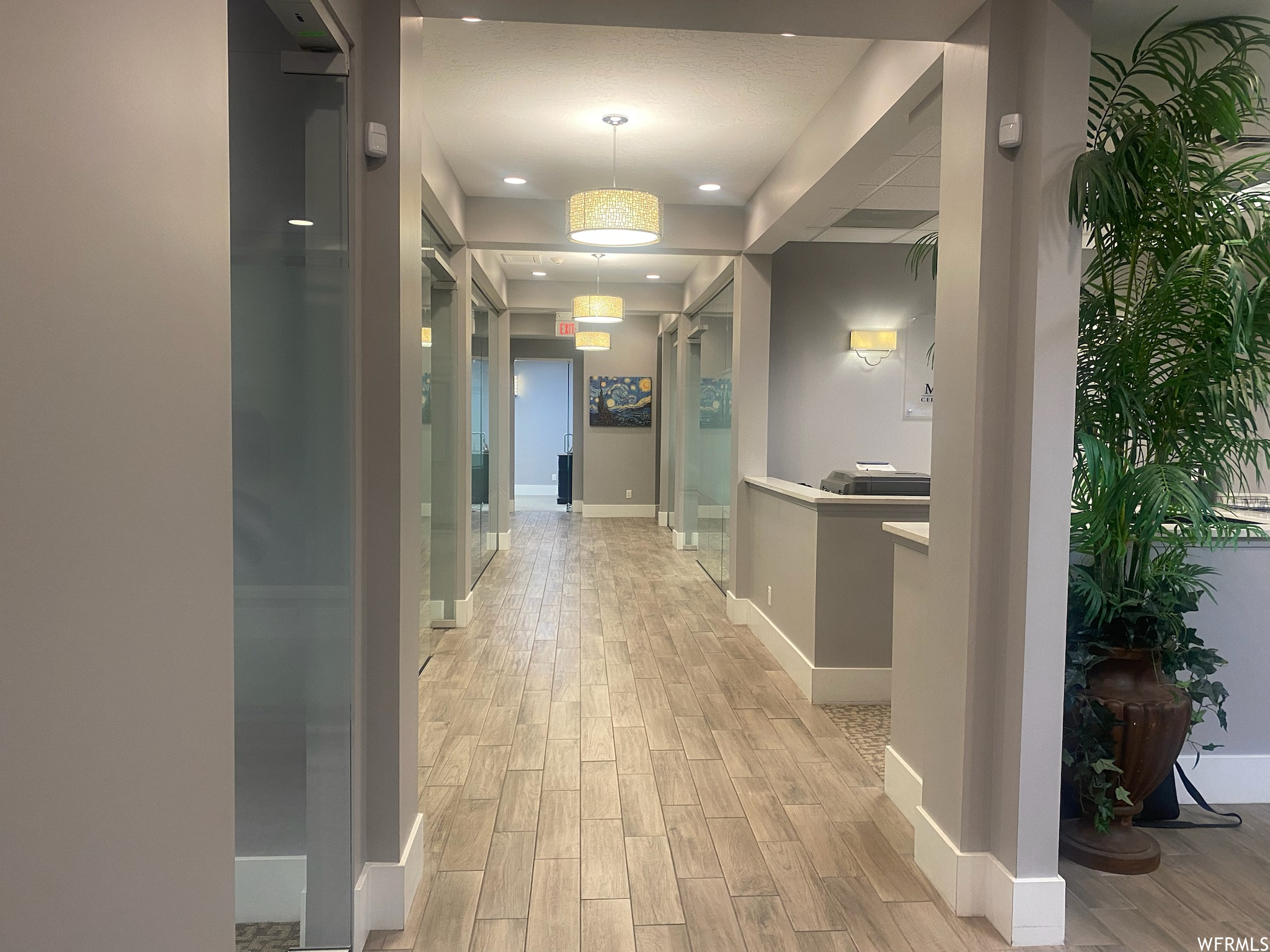 Corridor featuring light hardwood / wood-style floors