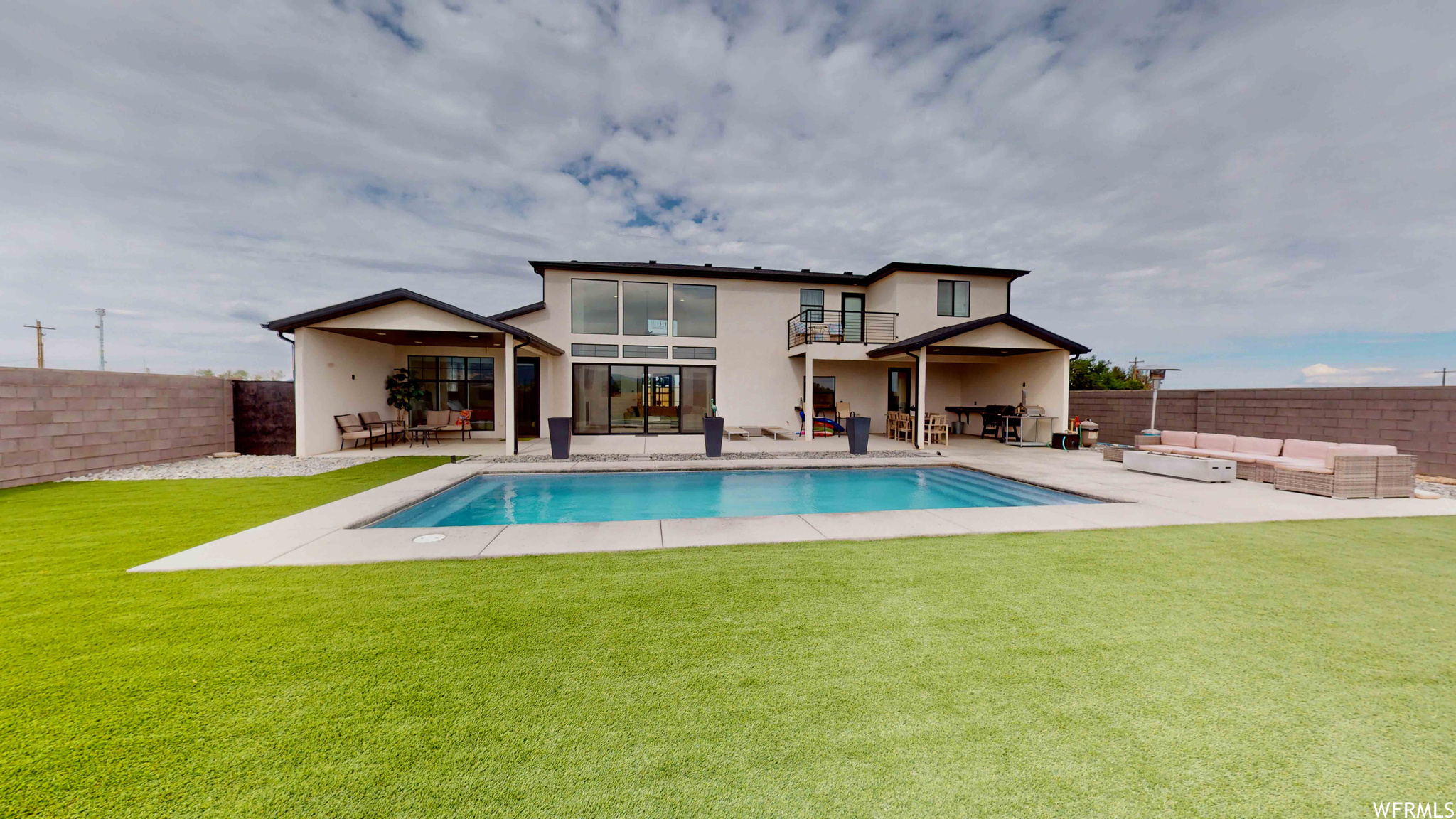 View of pool with a lawn, a patio, and an outdoor living space