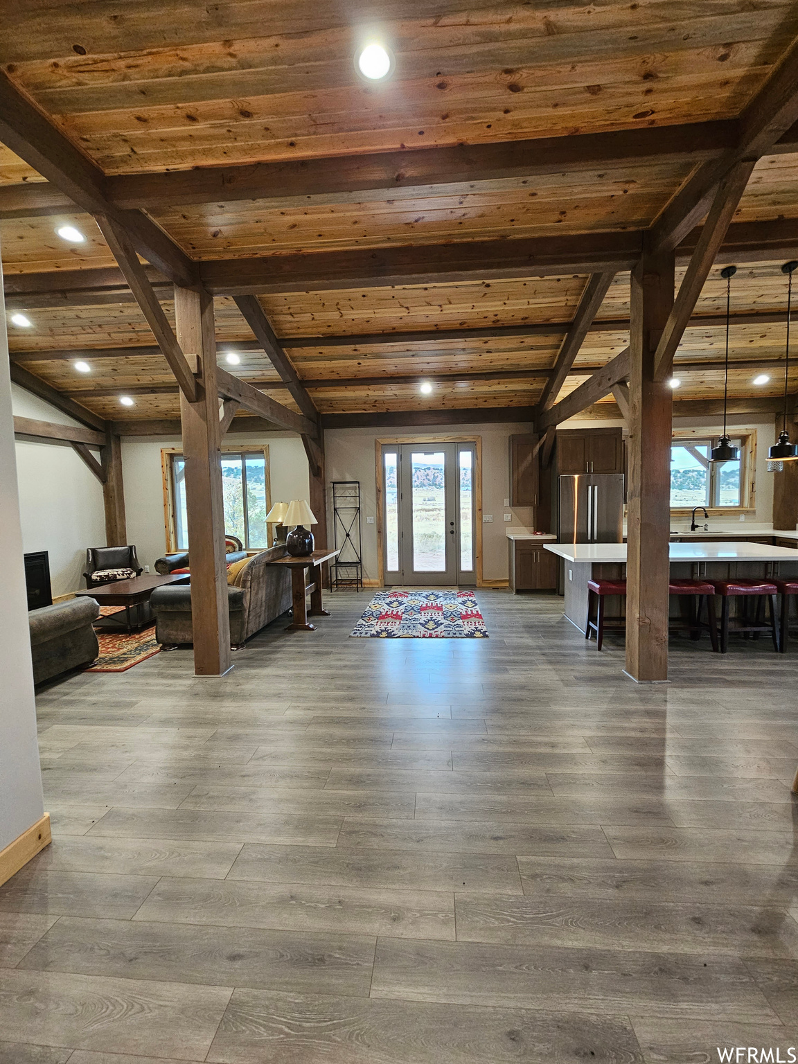 Entry way with wooden beams and beamed ceiling