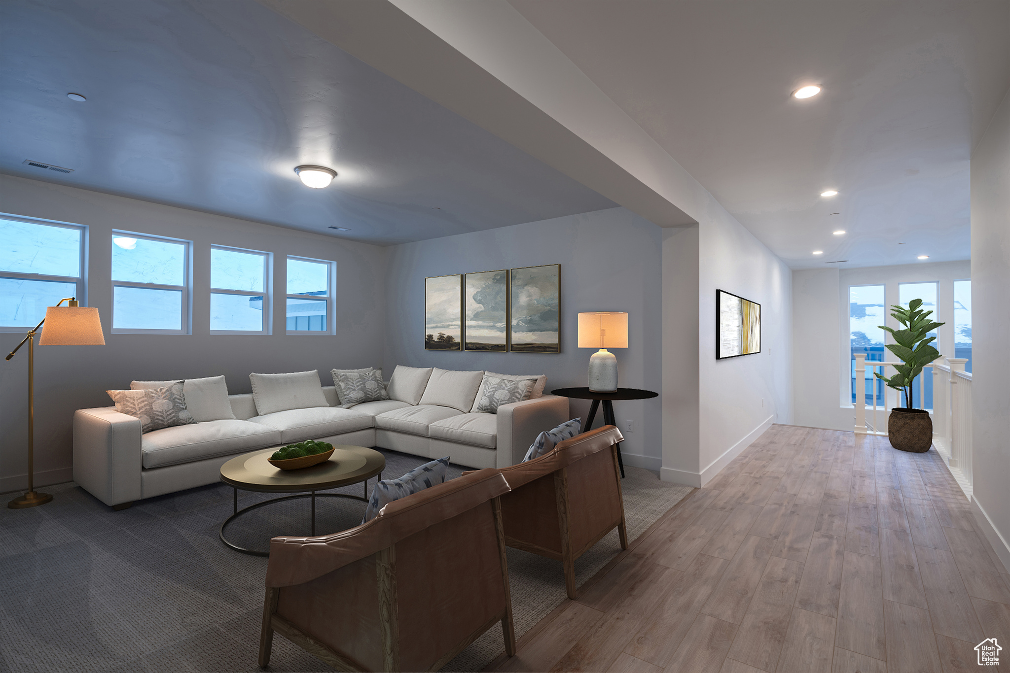 Living room featuring hardwood / wood-style floors and a wealth of natural light