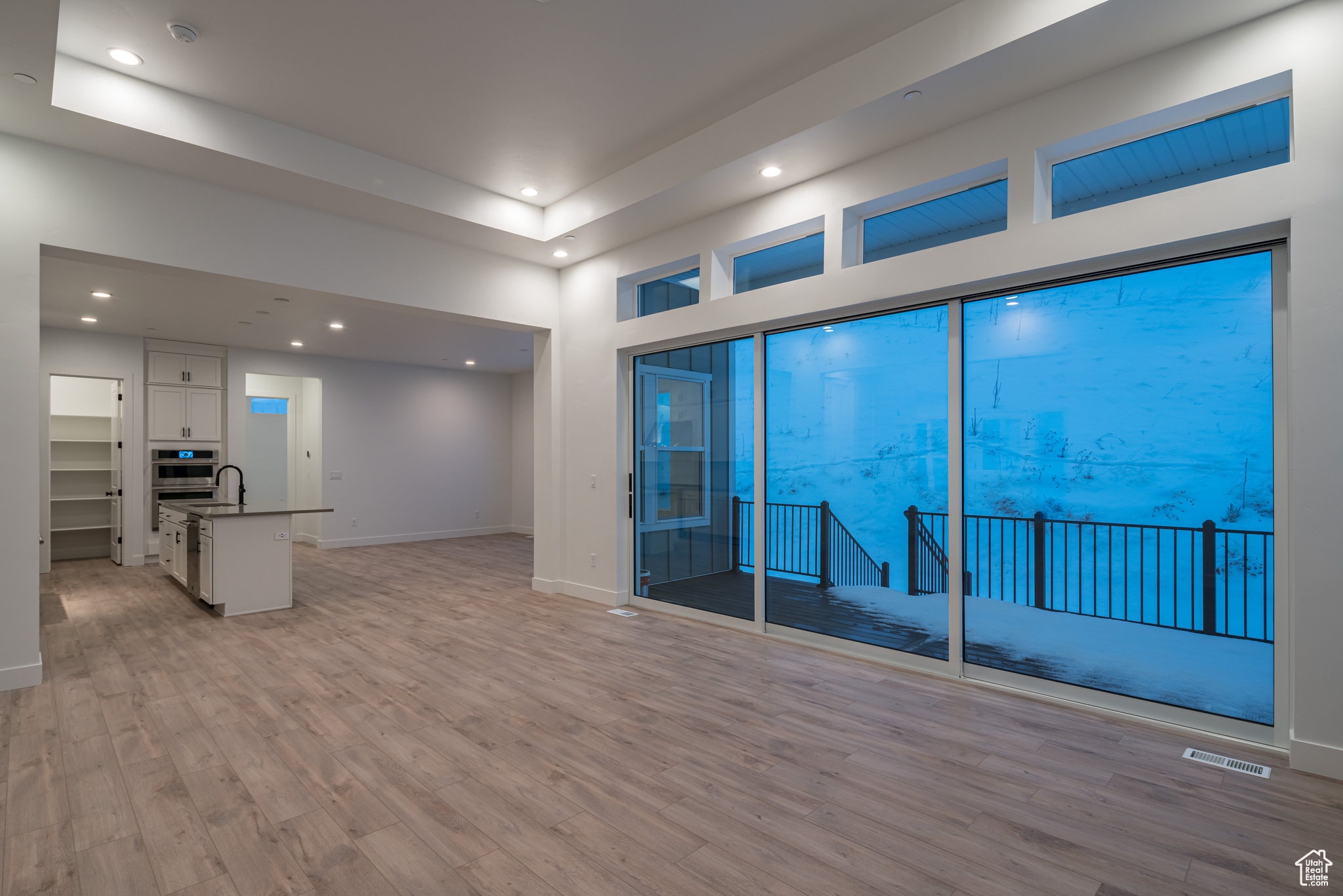 Empty room with light hardwood / wood-style floors