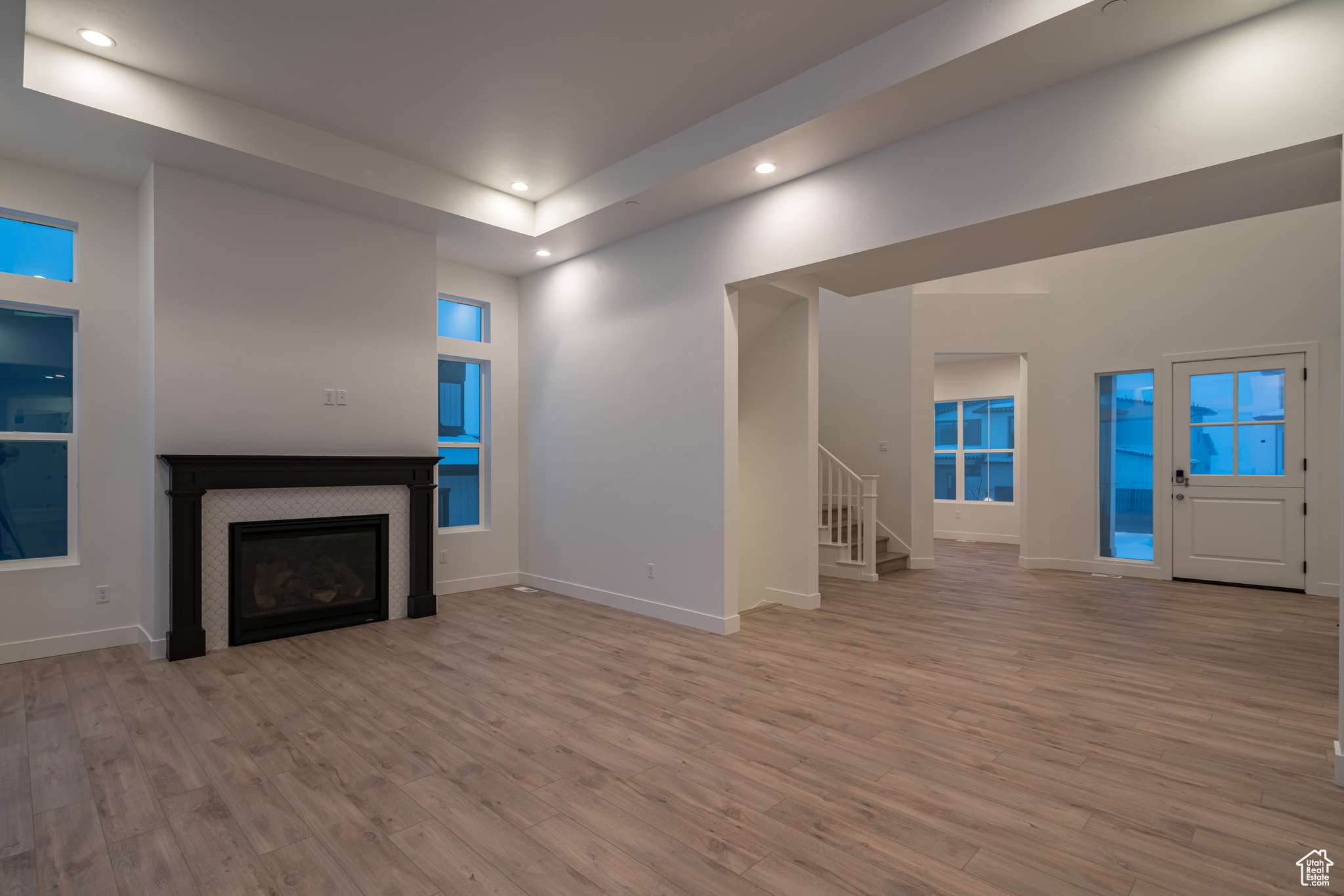 Unfurnished living room with light hardwood / wood-style flooring