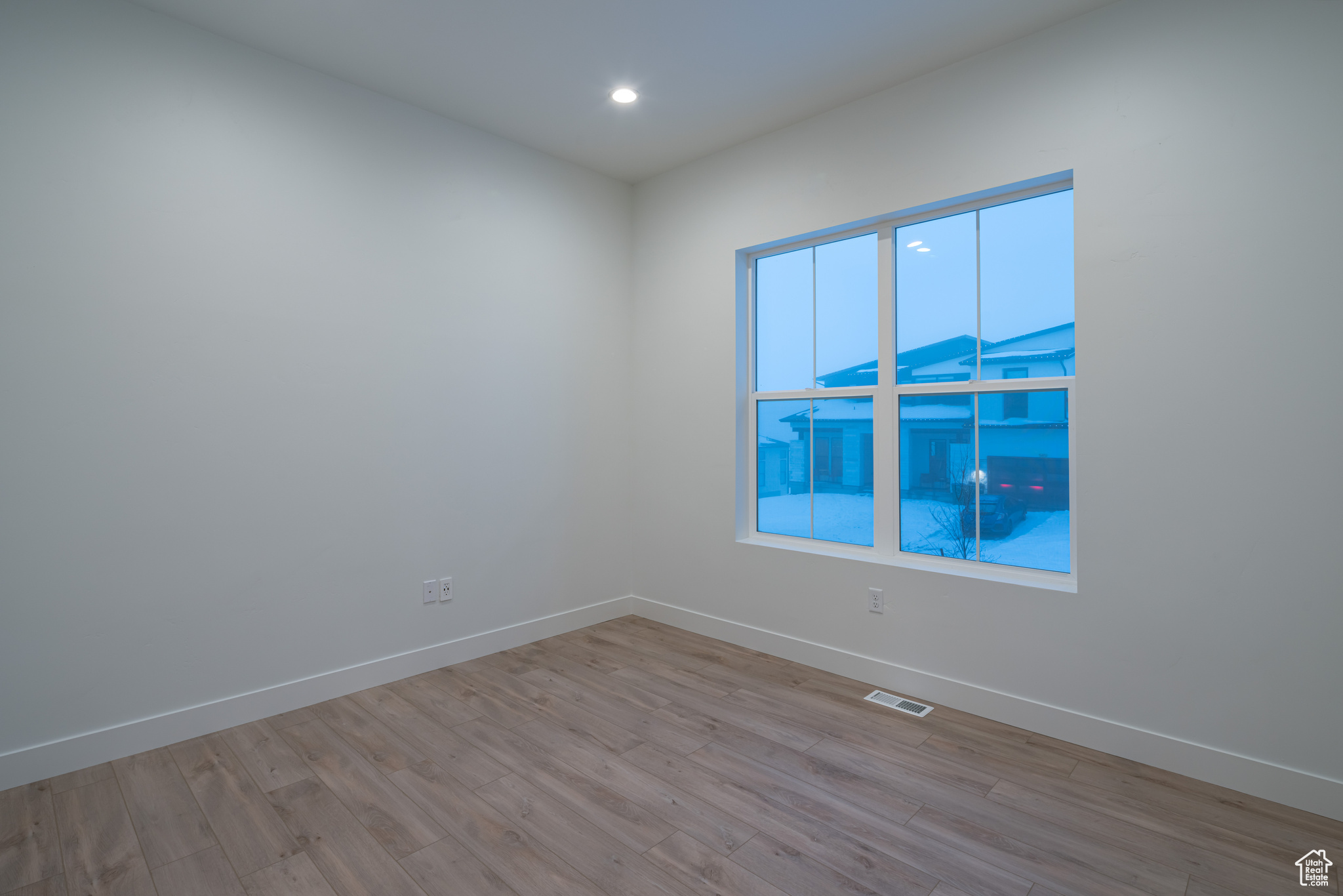 Spare room featuring light hardwood / wood-style floors