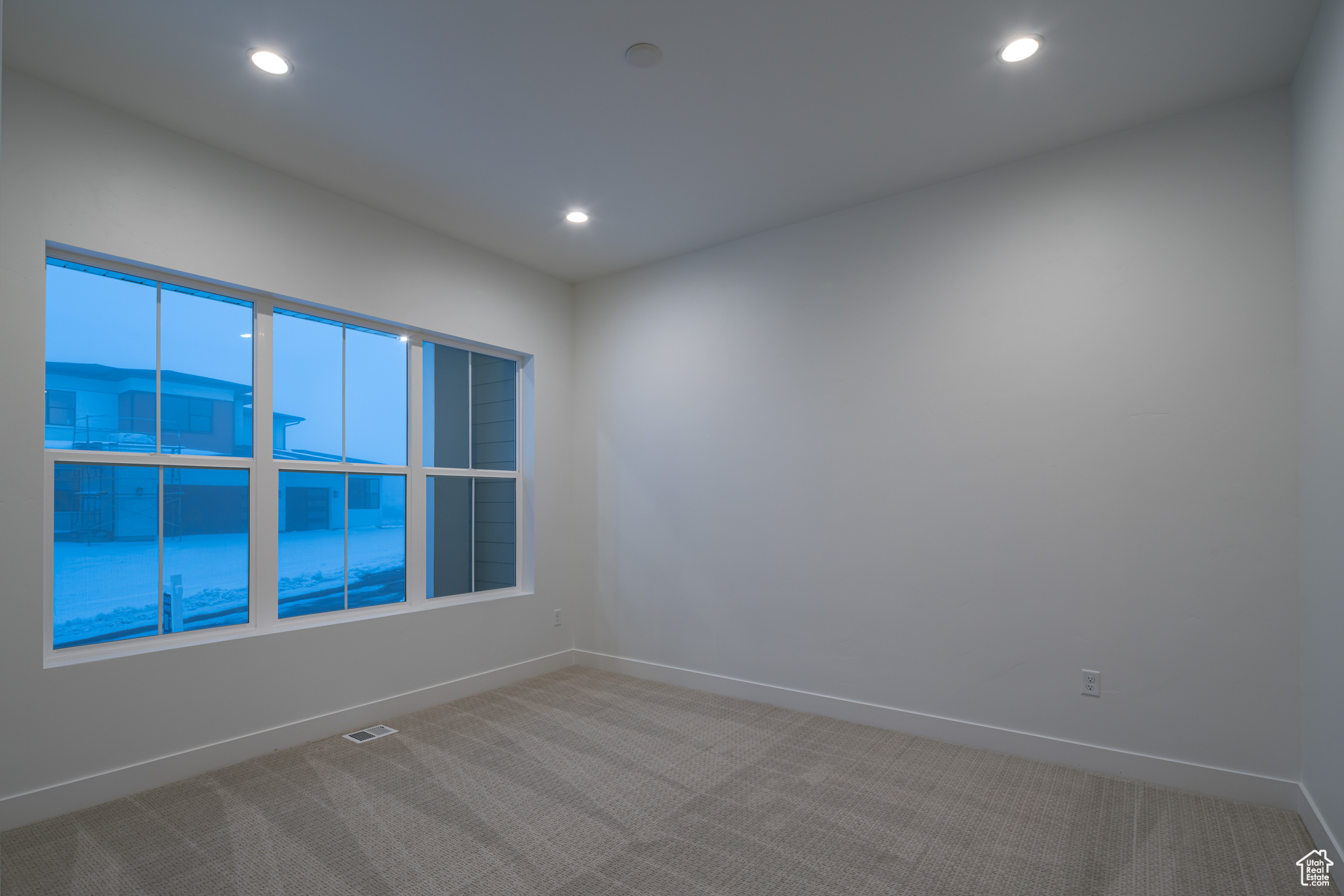 View of carpeted spare room