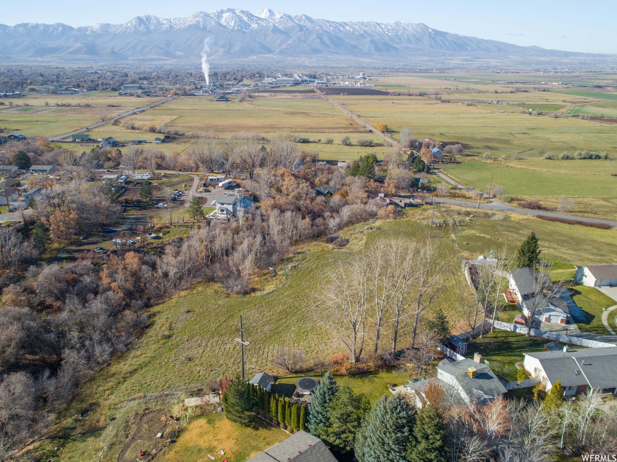 Birds eye view of property with a rural view and a mountain view