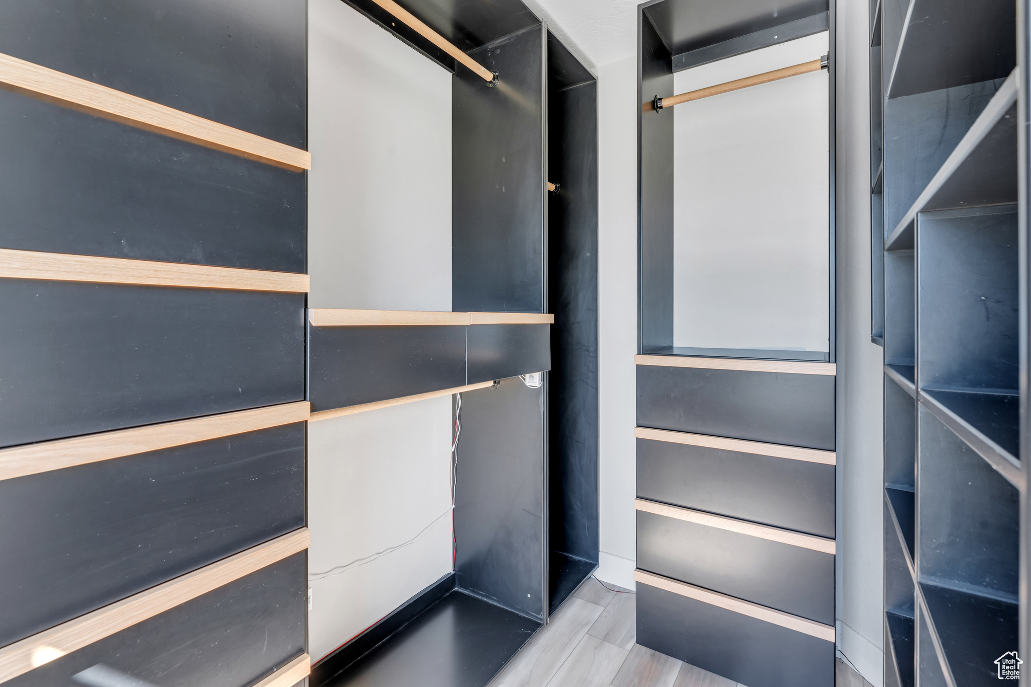 Walk in closet featuring light hardwood / wood-style floors