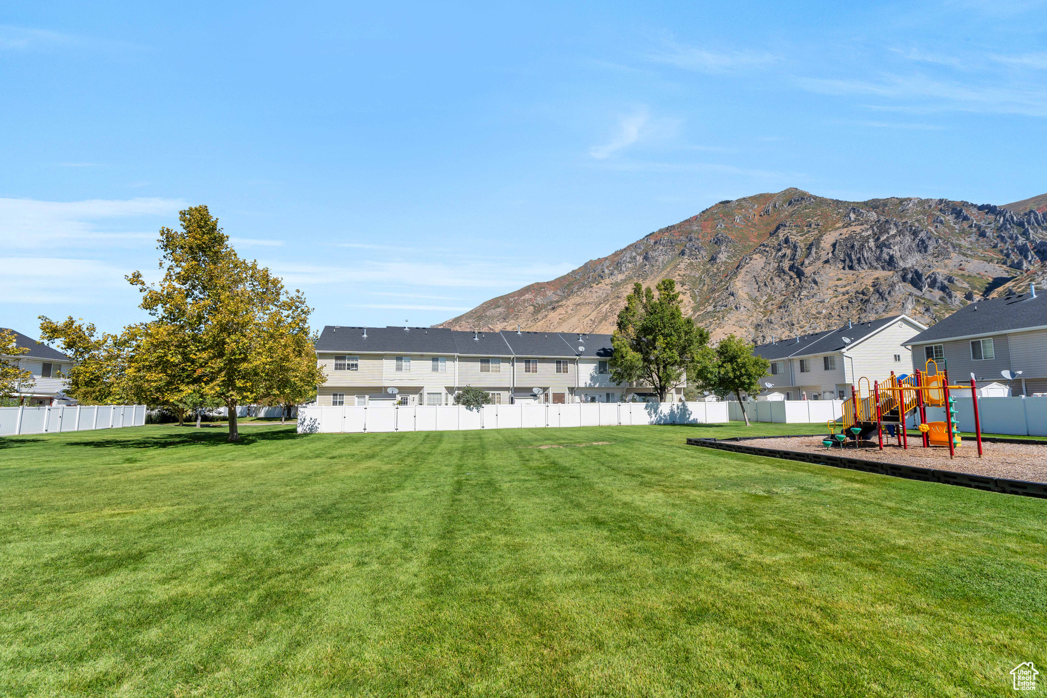 View of yard with a mountain view and a playground