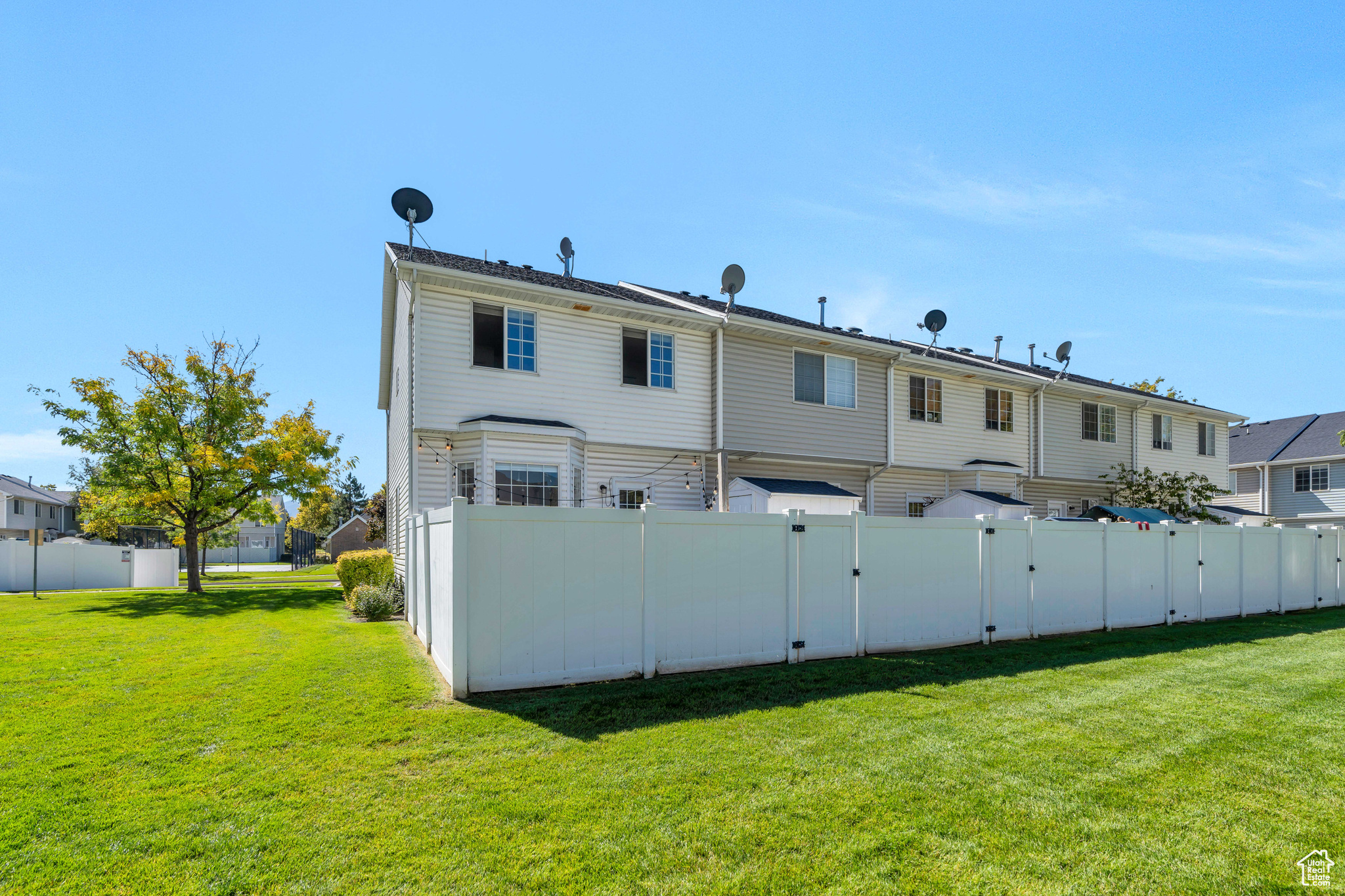 Back of property featuring a lawn