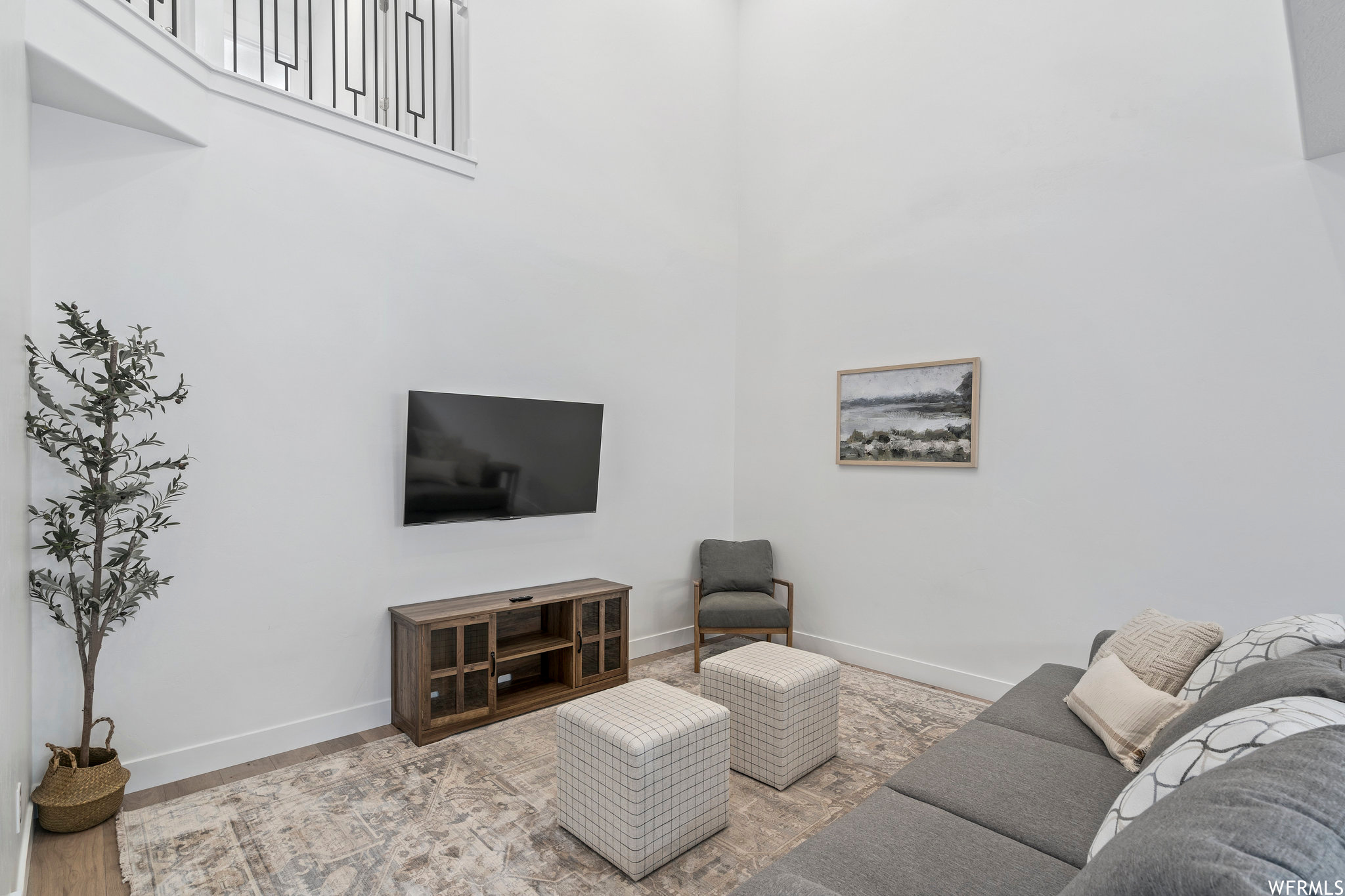 Living room with light hardwood / wood-style floors